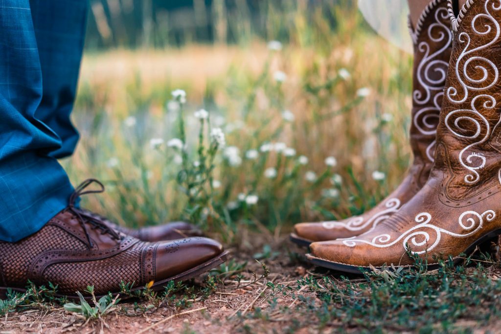 a groom's shoes and a bride's boots 