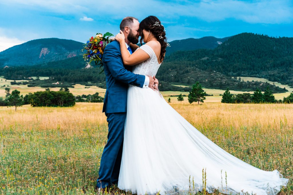 newlyweds embrace during their Colorado elopement in Larkspur