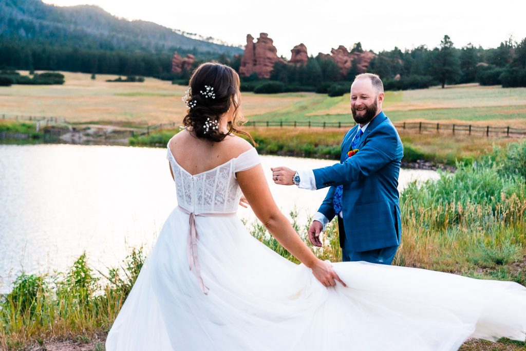 groom spins his wife around during their first dance at their Colorado elopement