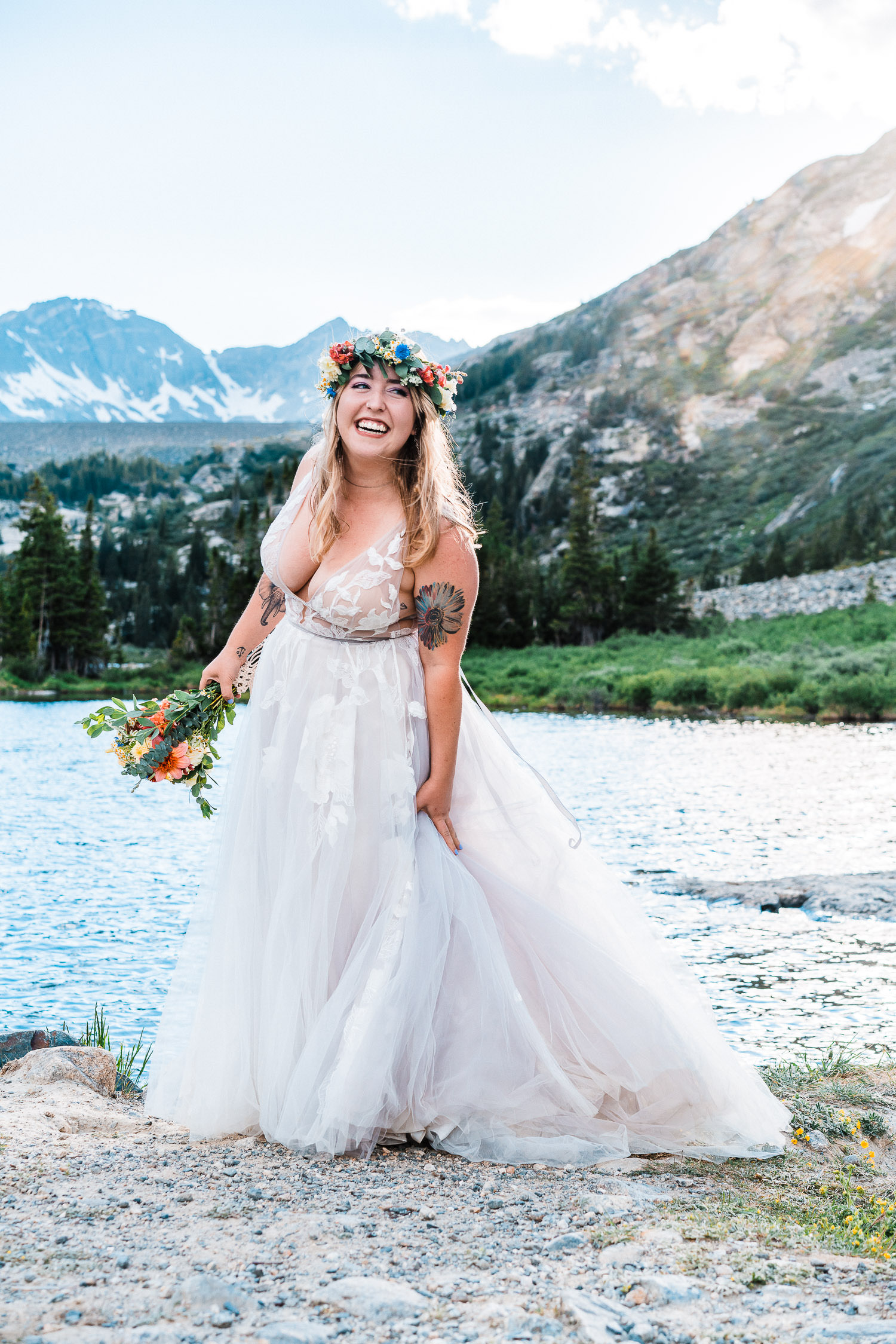bride smiling big beneath her bright flower crown at Blue Lakes during her Colorado elopement