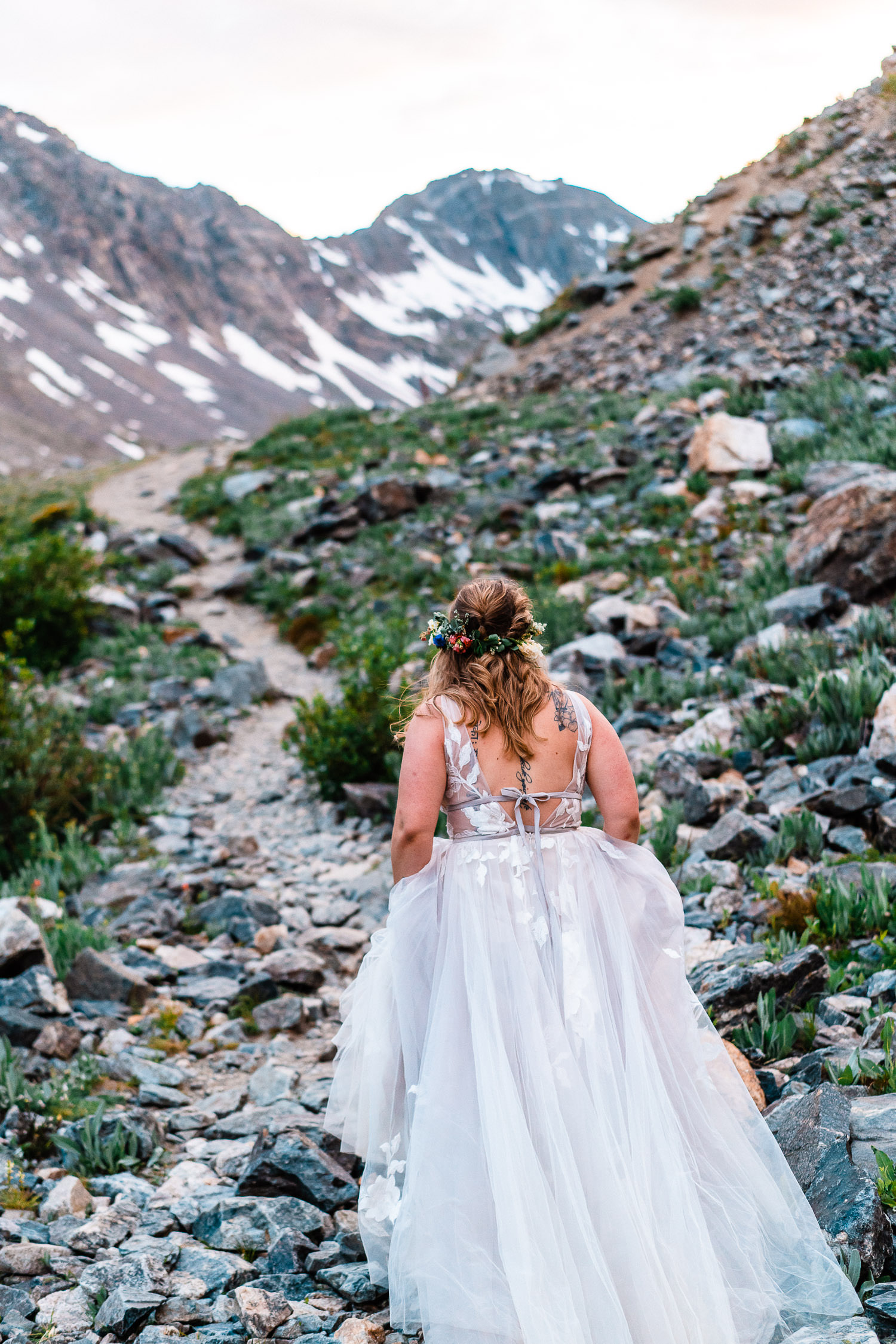 bride walking through Blue Lakes in Breckenridge, Colorado