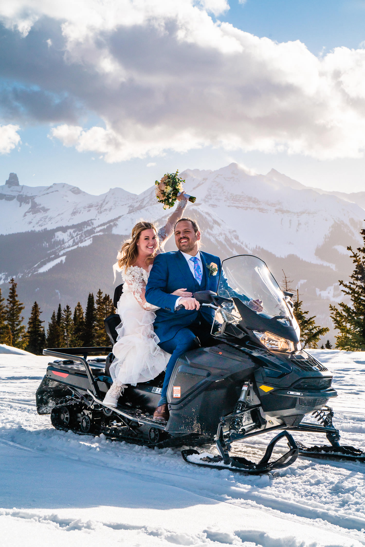 newlyweds on a snowmobile