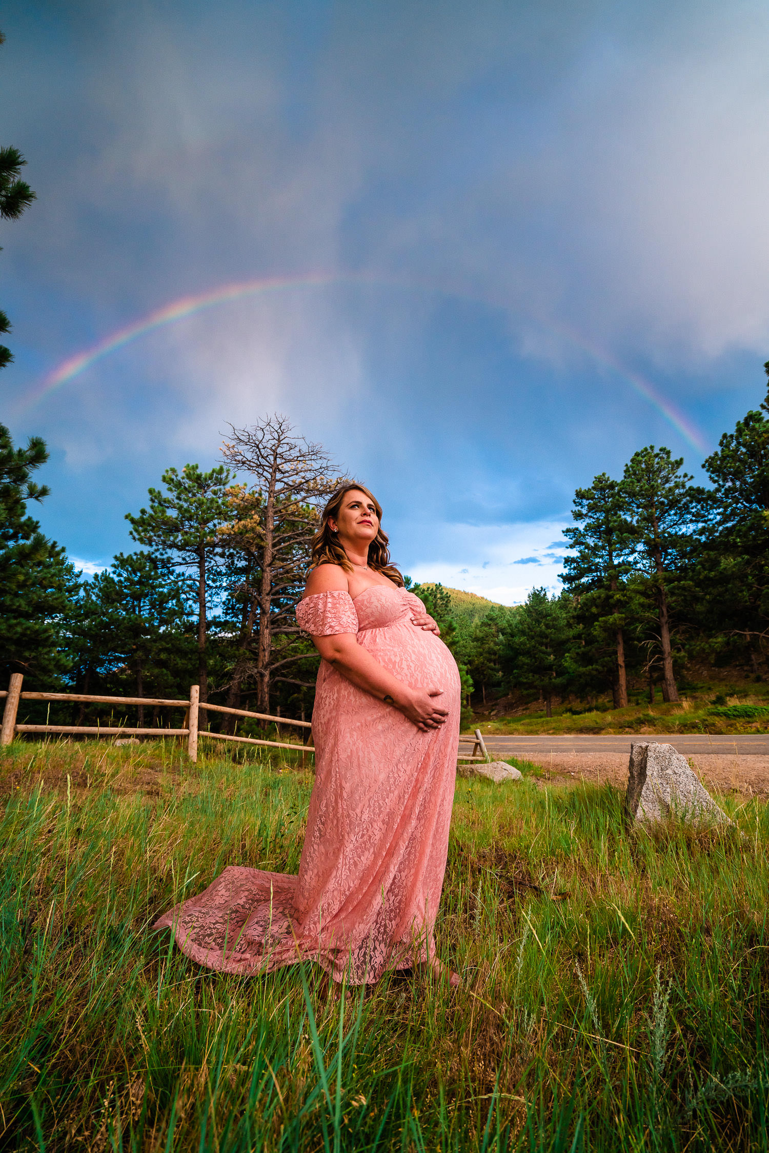 maternity portraits beneath a rainbow