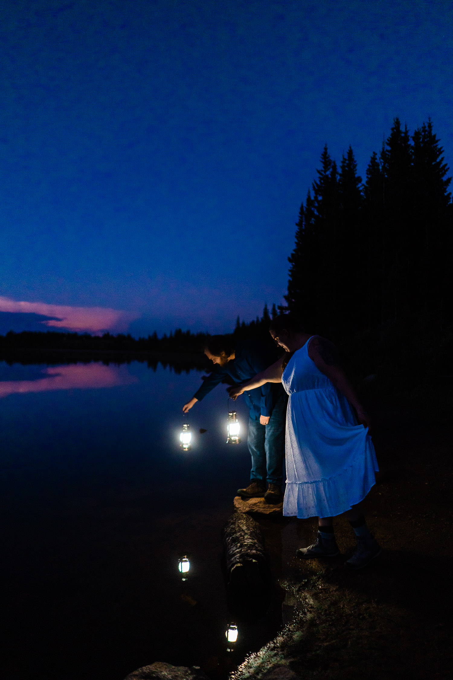newlyweds on a lake at sunrise