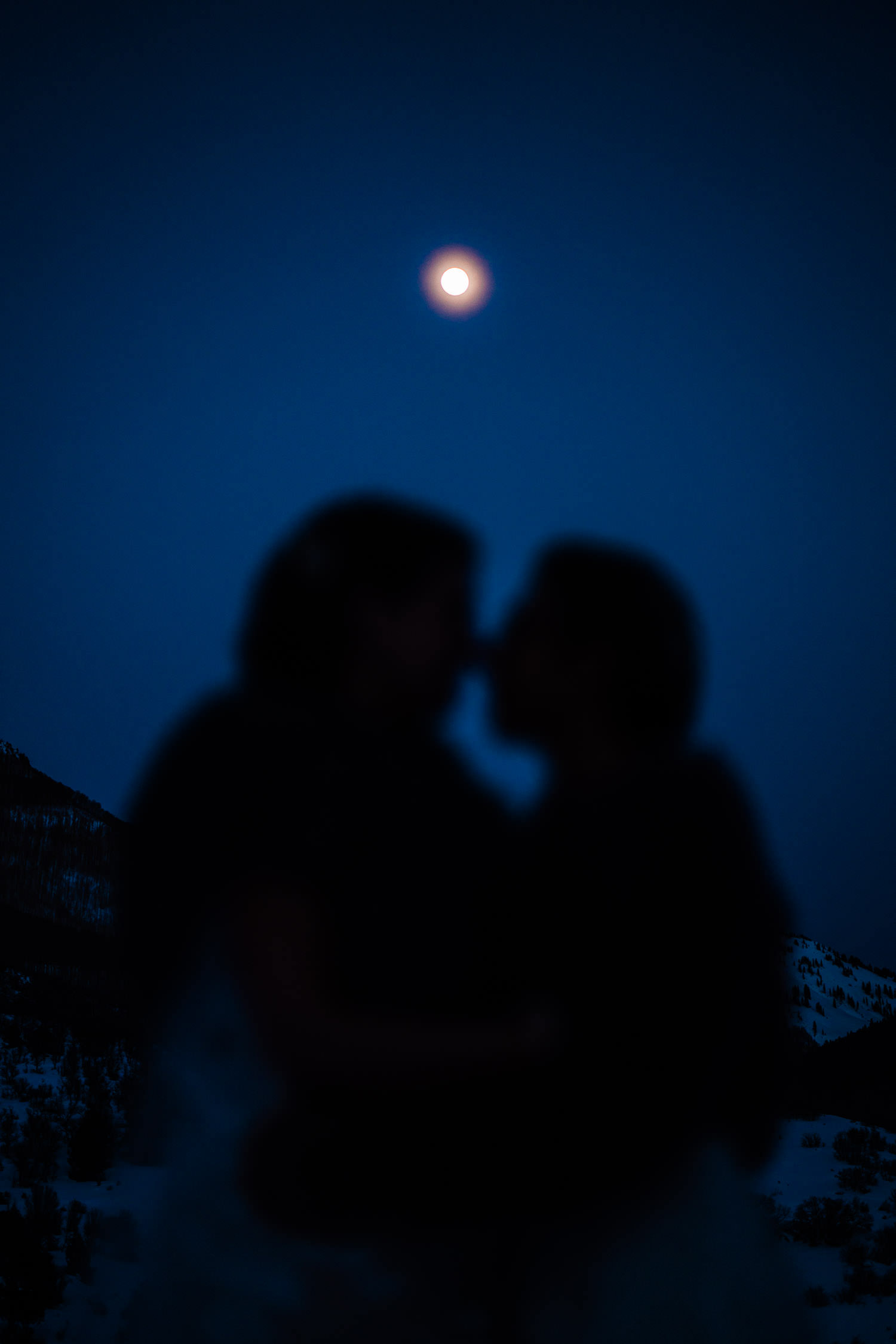 Newlywed lesbians beneath a full moon