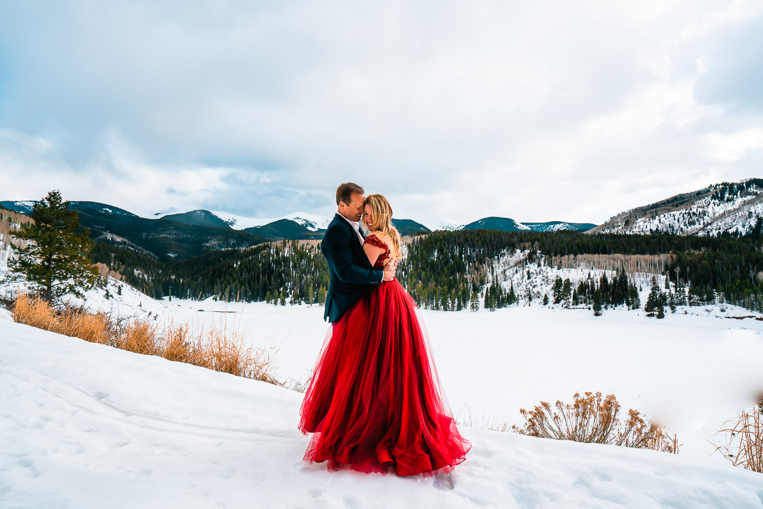 Couple Eloping in Winter bride wearing red wedding dress
