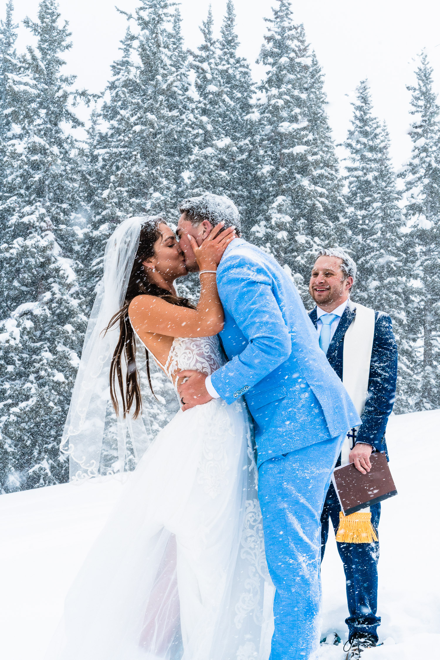 bride and groom kissing during their winter elopement