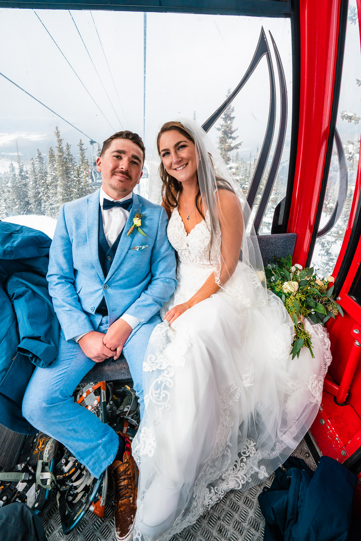 newlyweds on a ski lift during their Aspen elopement