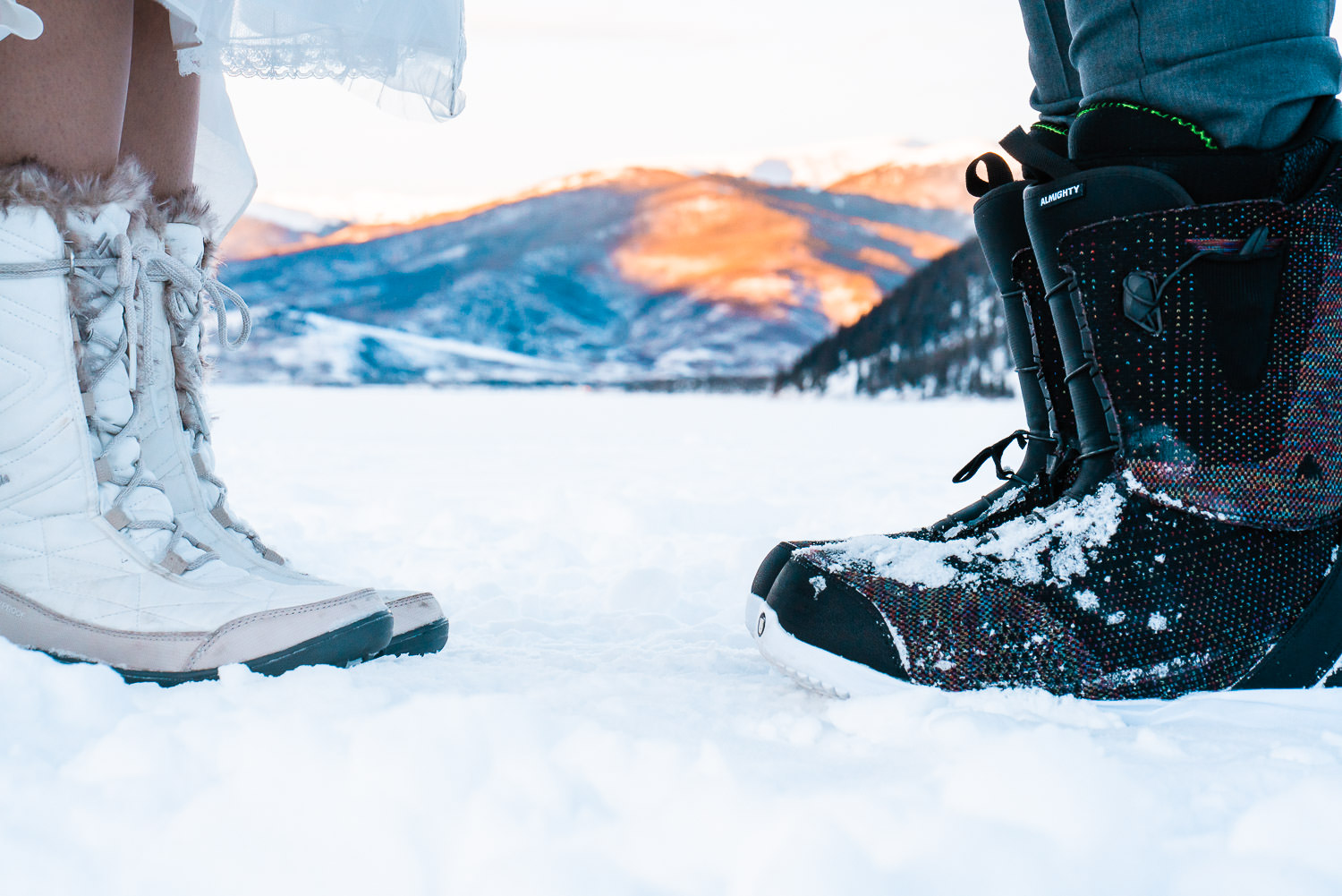 Newlyweds wearing snow boots during their Colorado winter elopement