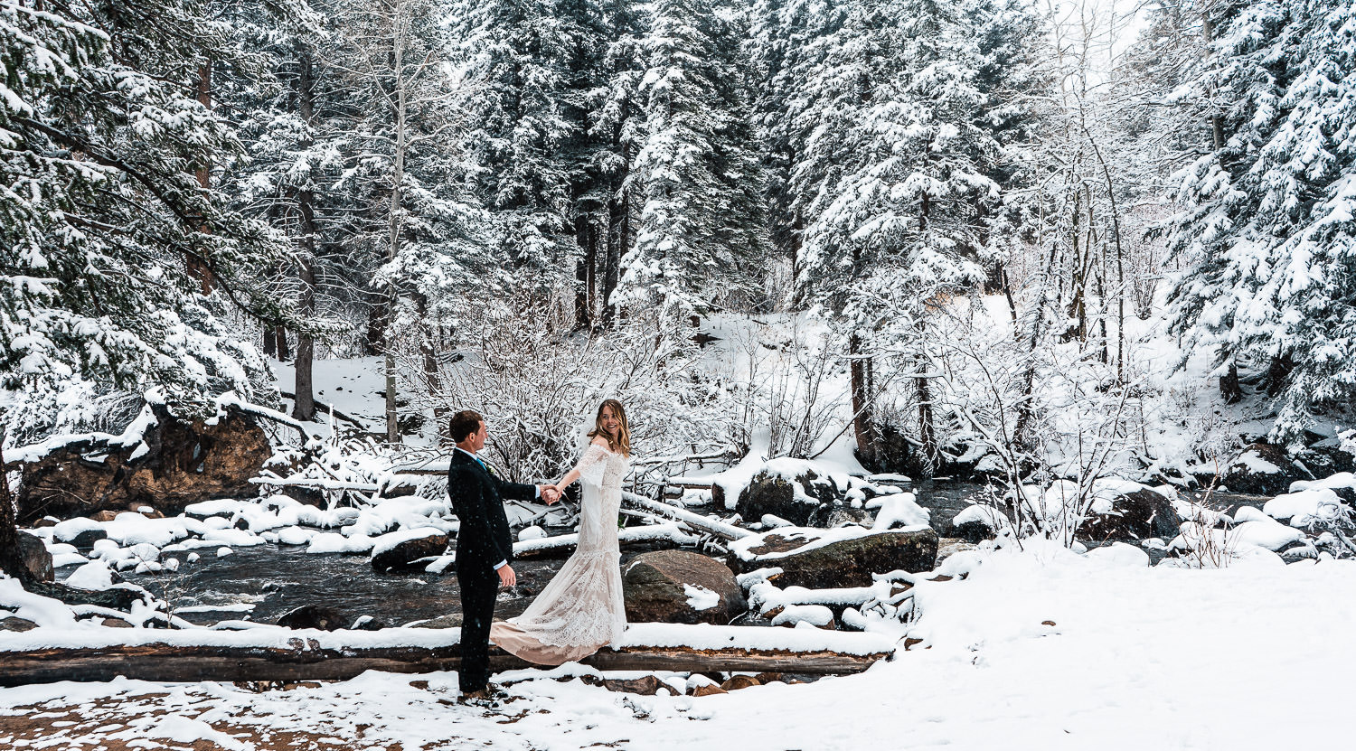 newlyweds explore Rocky Mountain National Park during their Colorado winter elopement
