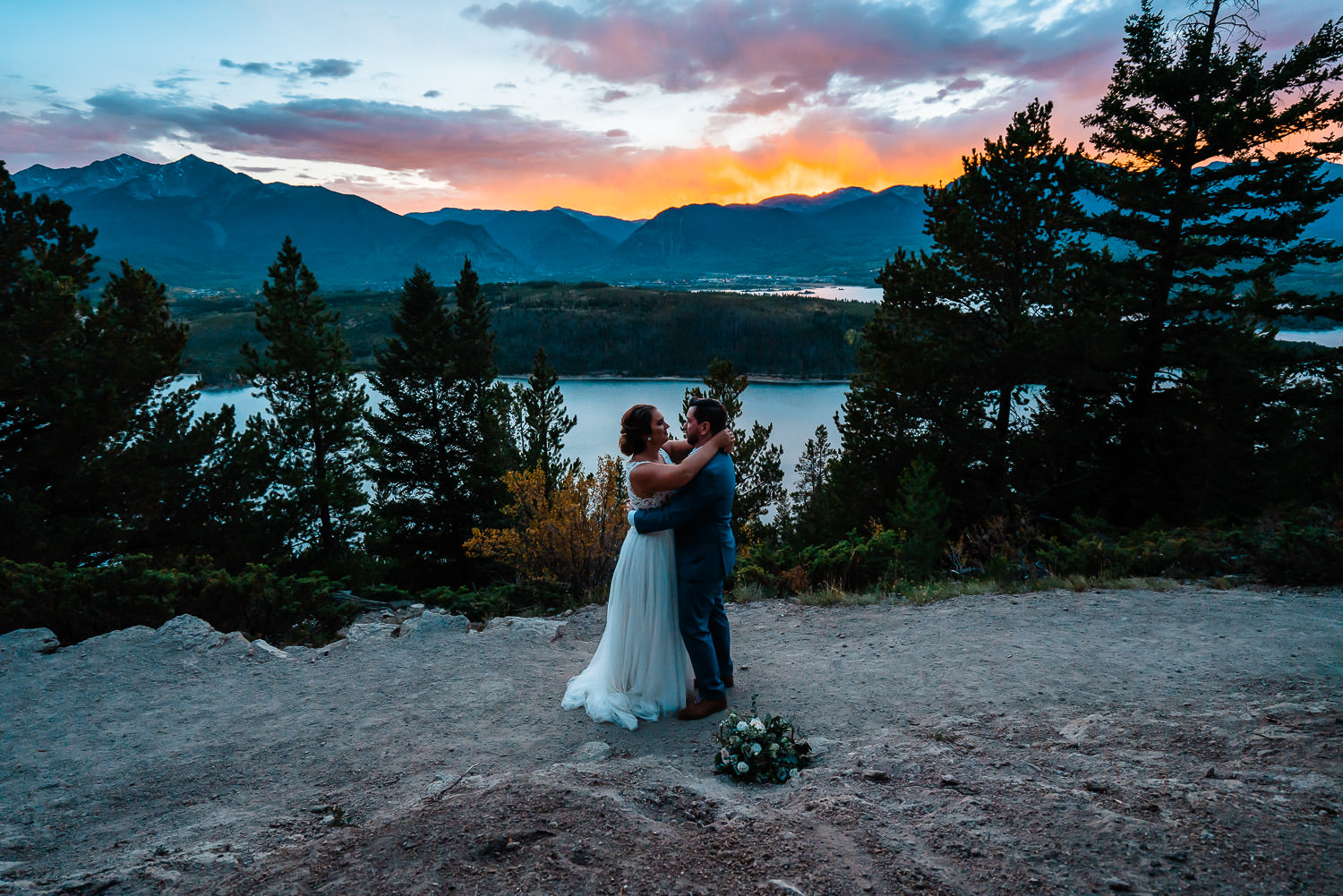 Couple enjoys a first dance at sunset overlooking Lake Dillon during their Breckenridge Elopement 