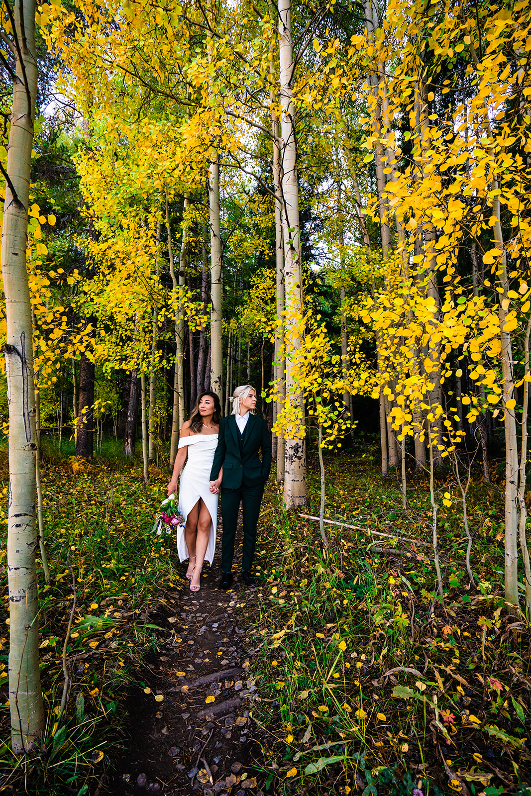 Two brides elope in Crested Butte in Colorado among aspen trees