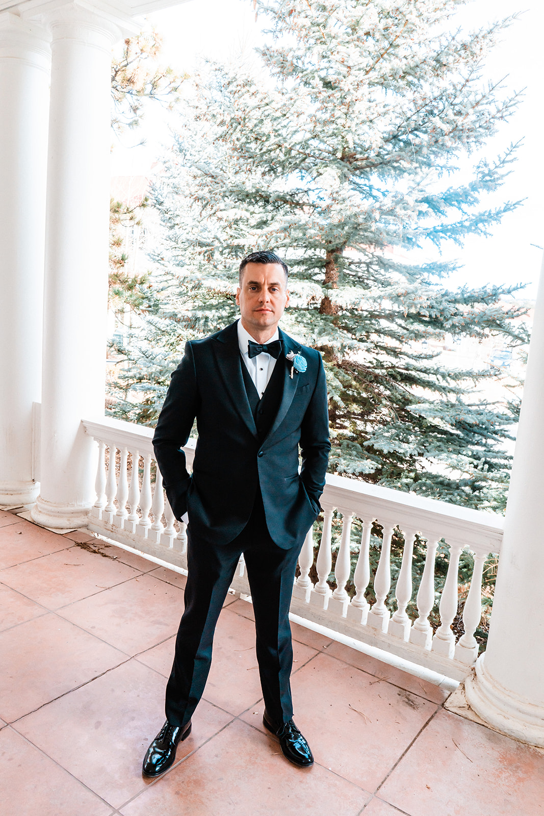 Groom posing at the Stanley Hotel in Estes Park