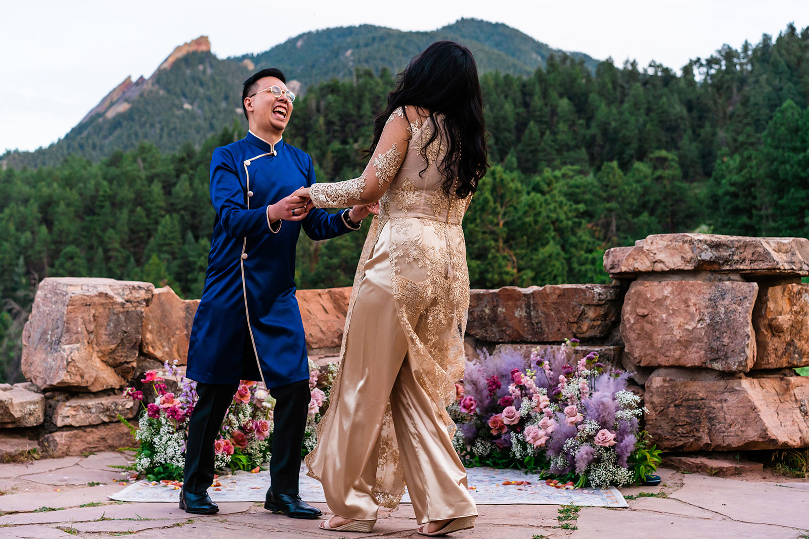 Bride and groom dancing at the Boulder Flatirons.