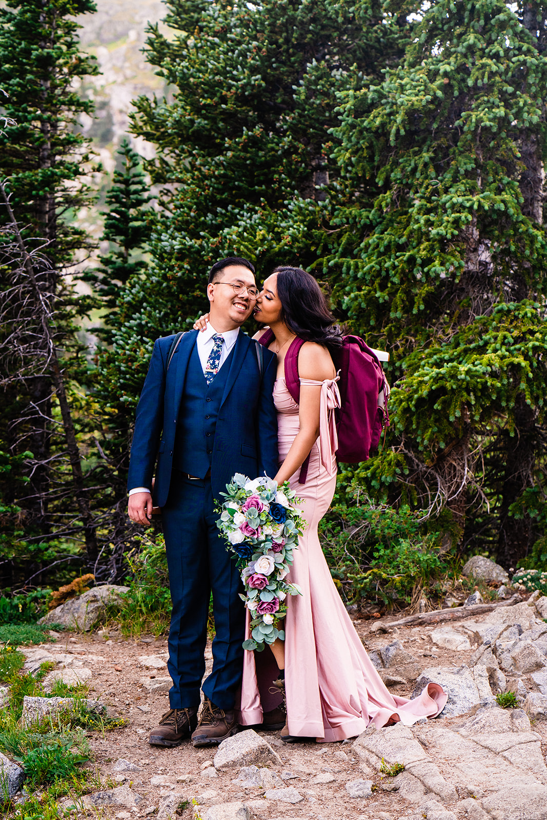 Beautiful bride and groom during their outdoor boulder elopement day