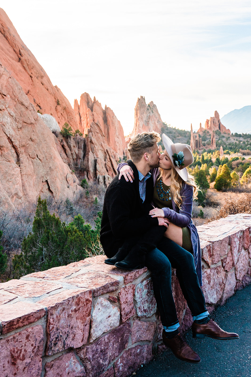 Newly engaged coupe kissing at the Garden of the Gods