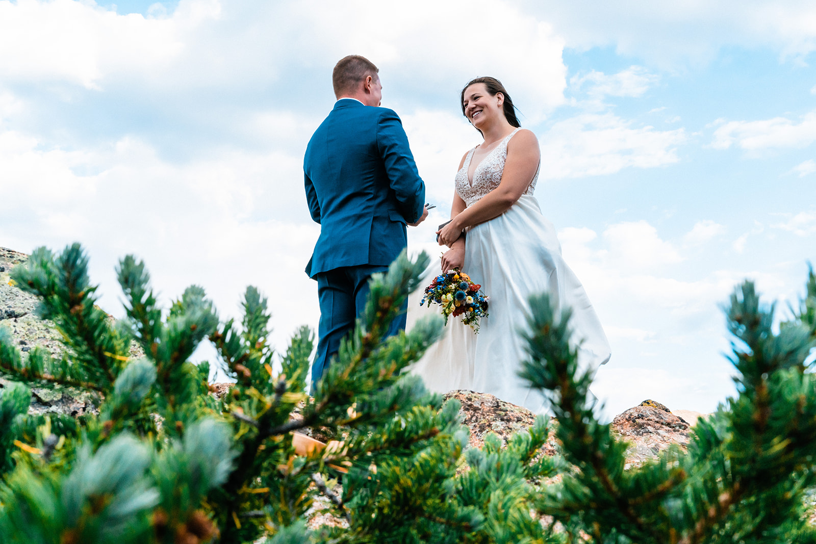 Bride and groom exchanging vows on the mountains of Colorado