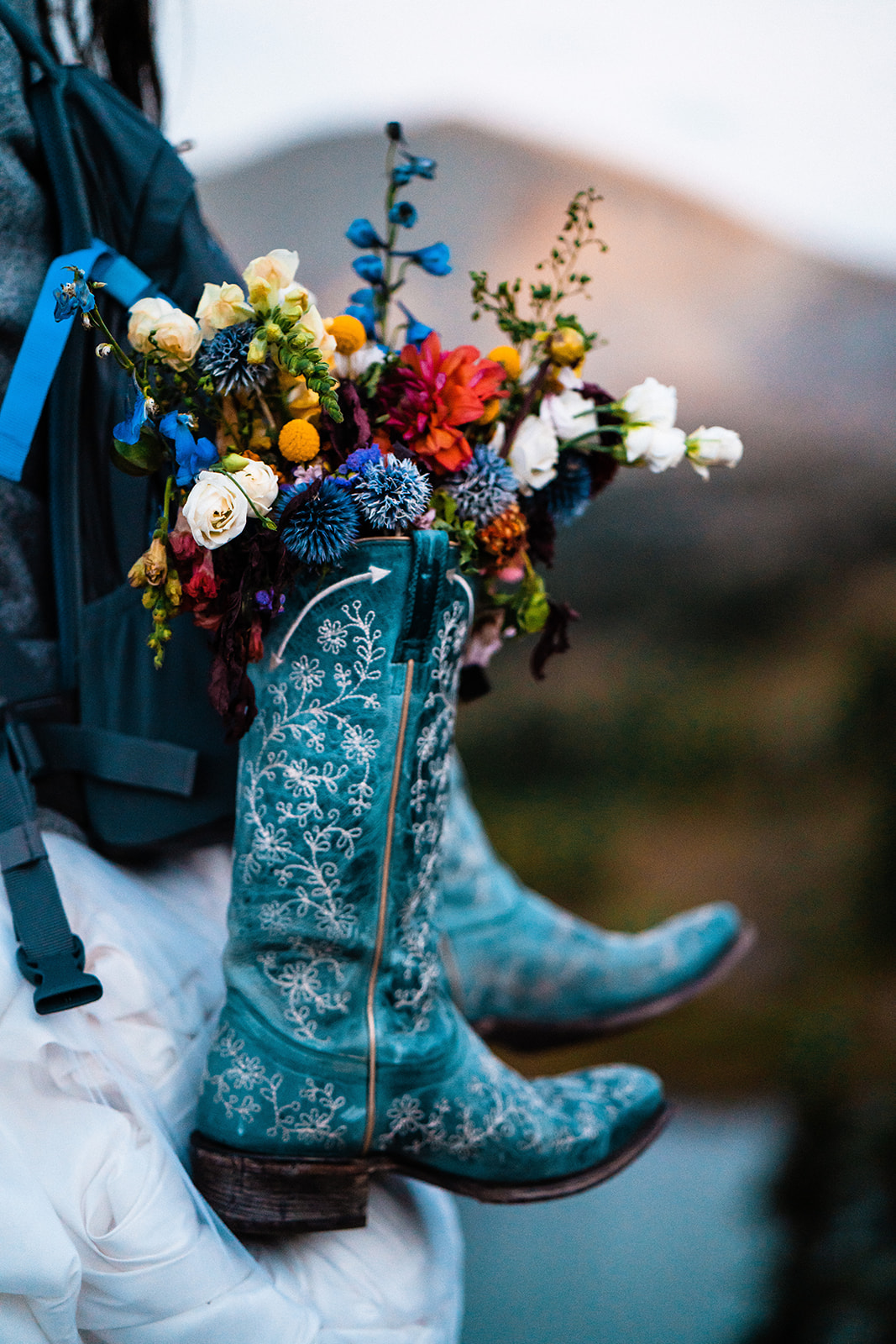 Brides cowboy boots and bridal bouquet