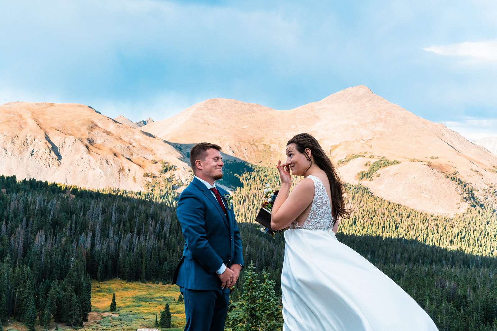 Bride and groom exchanging vows on the mountains of Colorado
