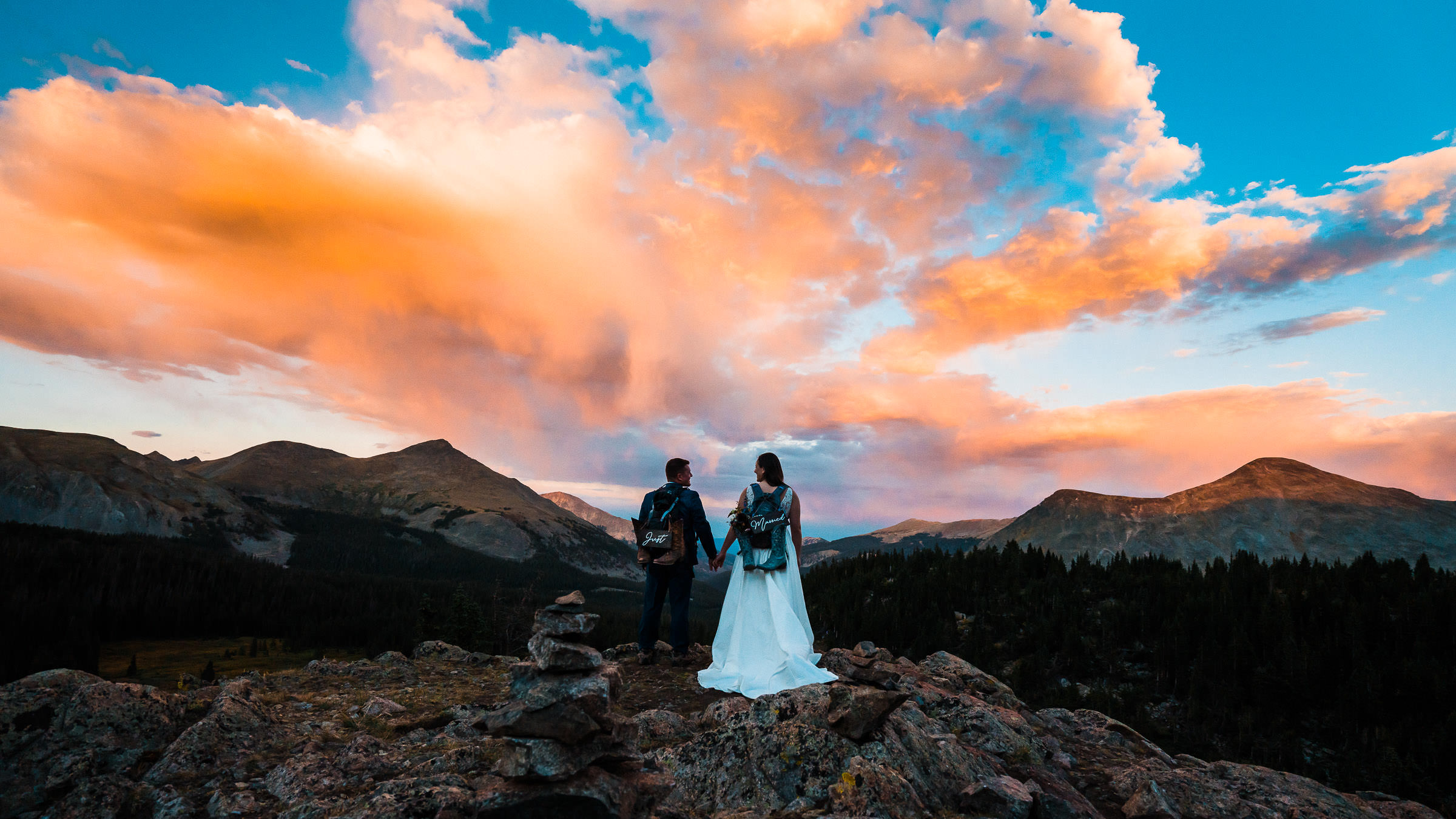 Bride and groom hiking during their elopement in Colorado at sunset