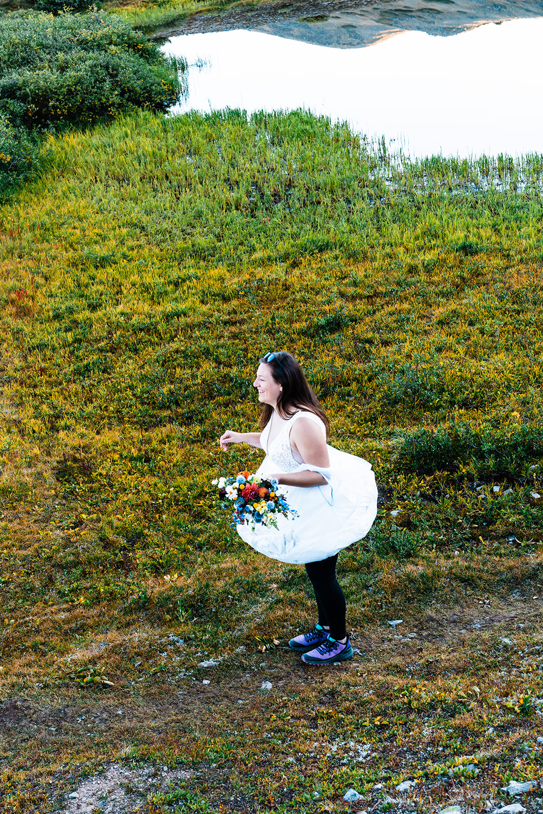 Stunning bride dancing in the mountains of Colorado