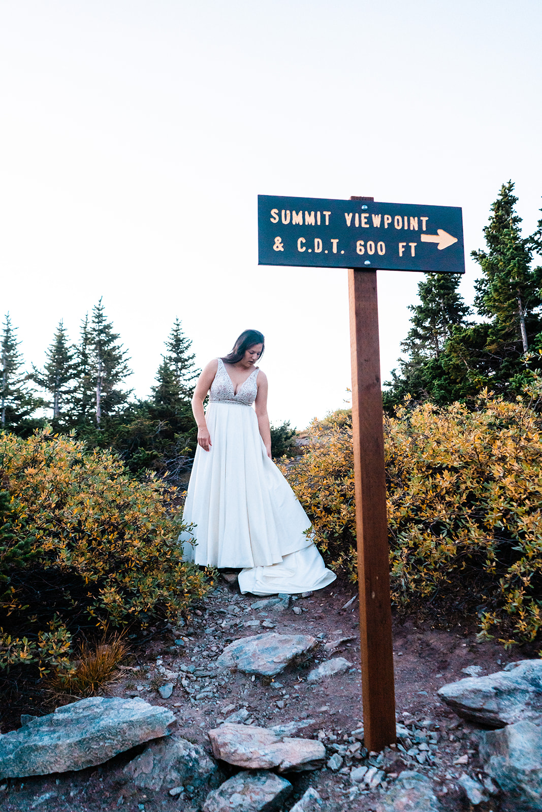 Bride in a beautiful white elopement dress in the mountains of Colorado