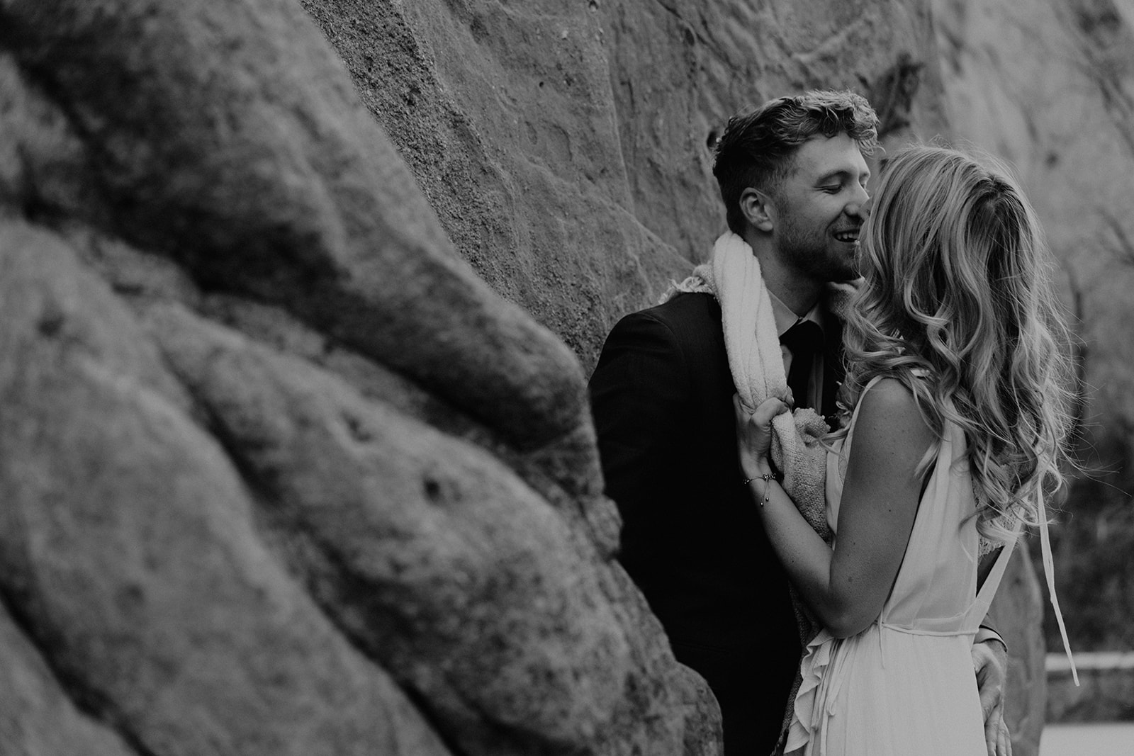 Newly engaged couple kissing at The Garden of the Gods