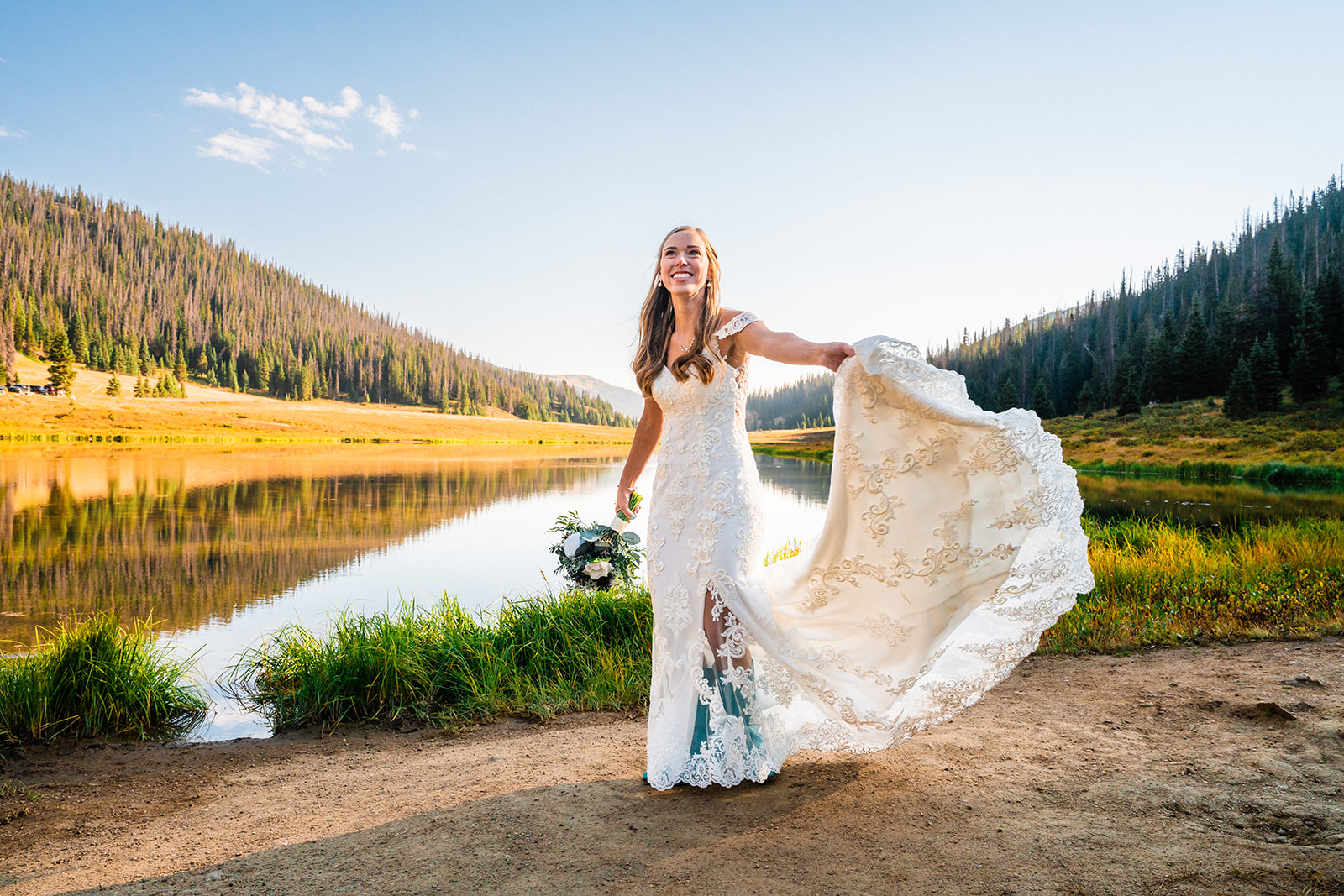 Bride posing at High Alpine Lake in Colorado