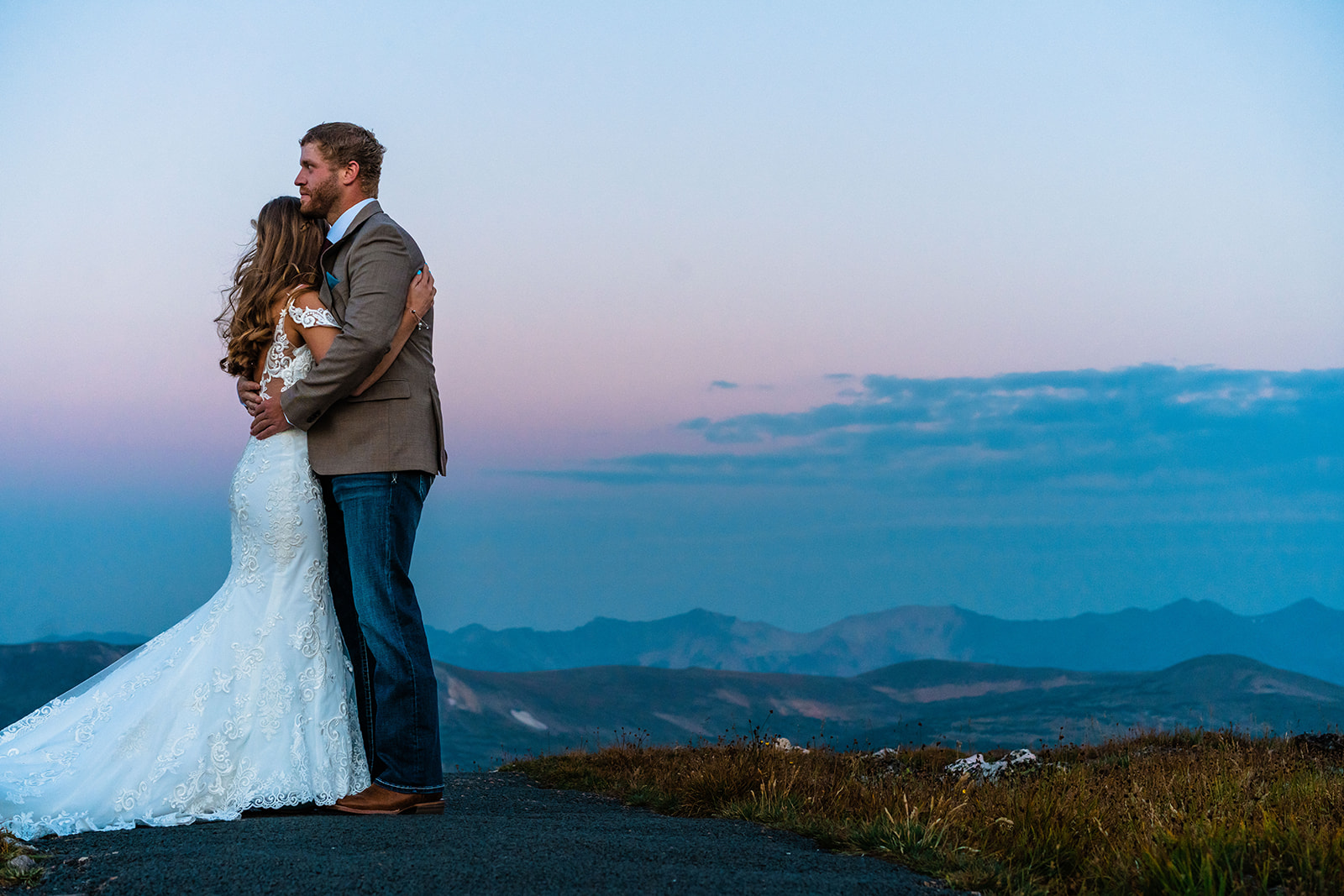 Bride and groom hugging one another at at Trail Ridge Road