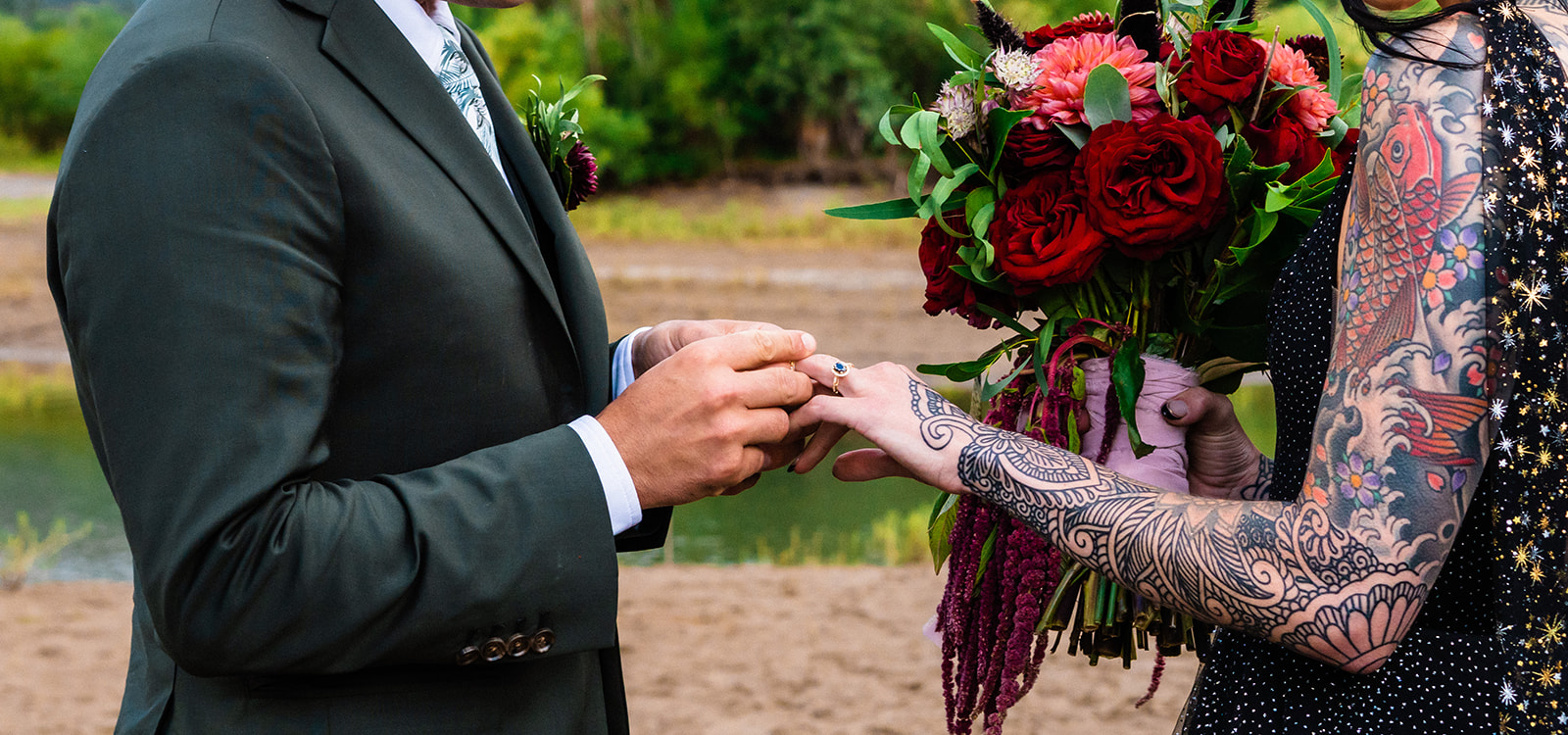 Bride and groom exchanging rings during their celestial themed elopement
