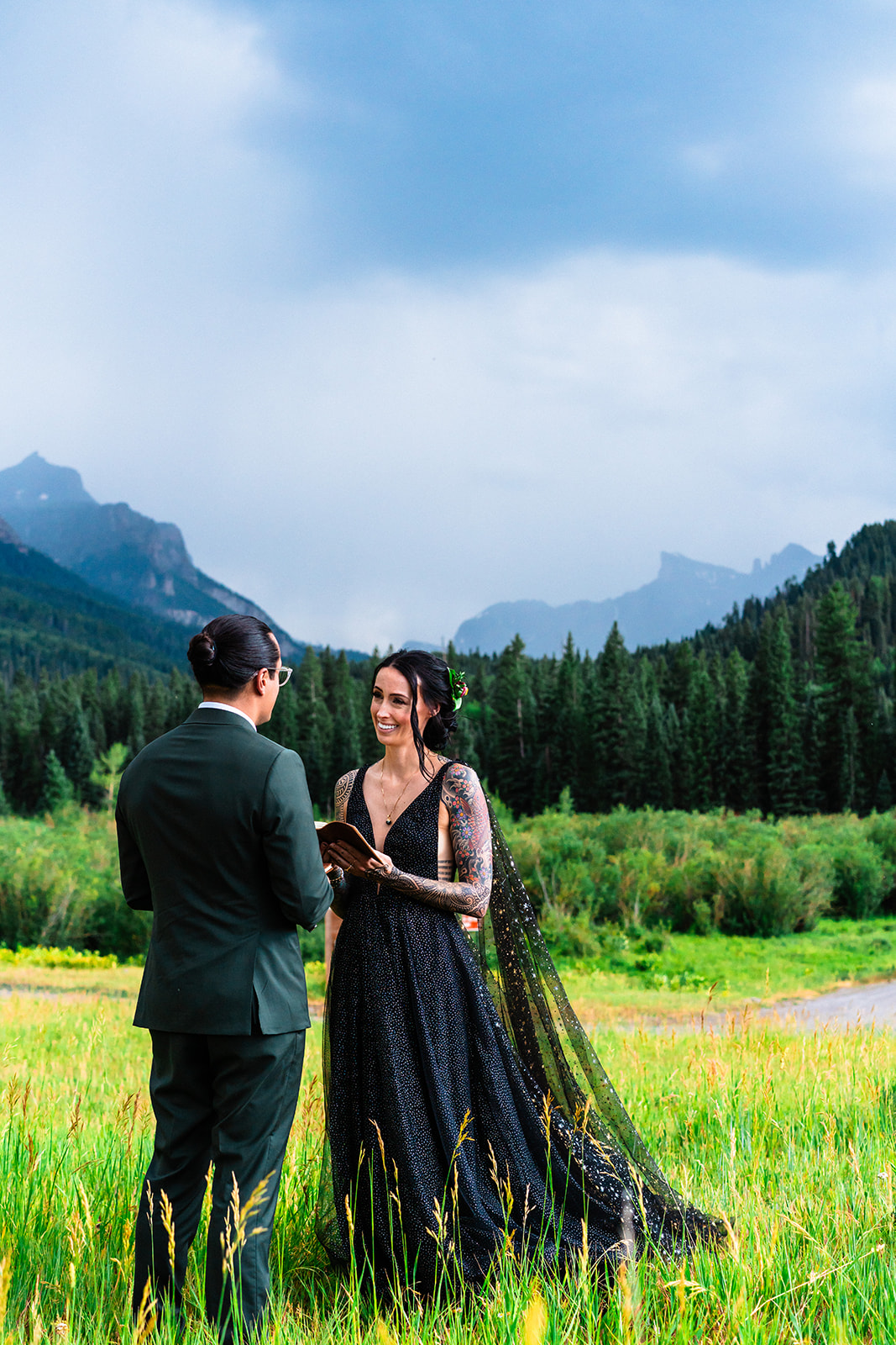 Bride and groom exchanging vows in the mountains of Colorado