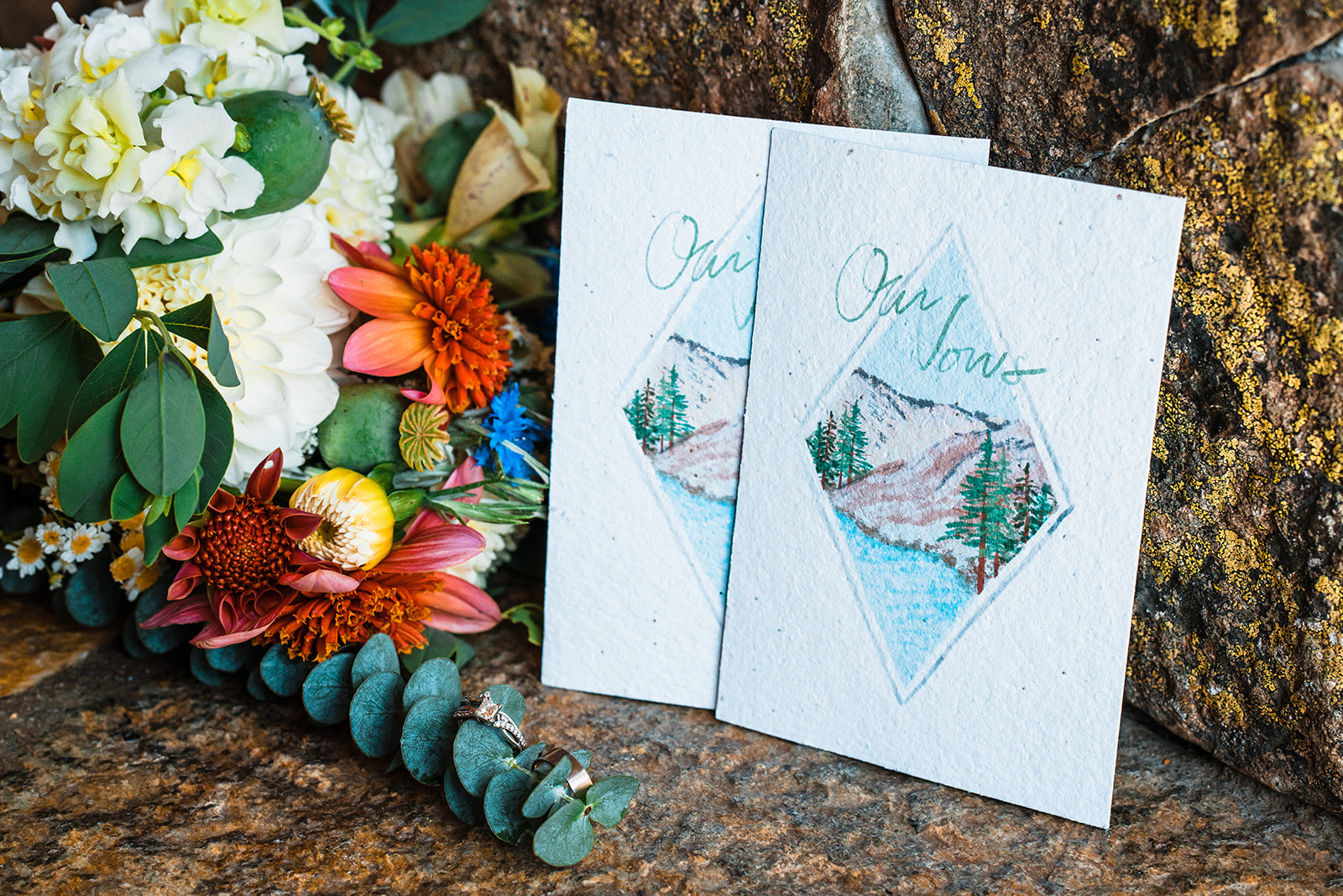 Bride and grooms biodegradable vow cards and floral bouquet