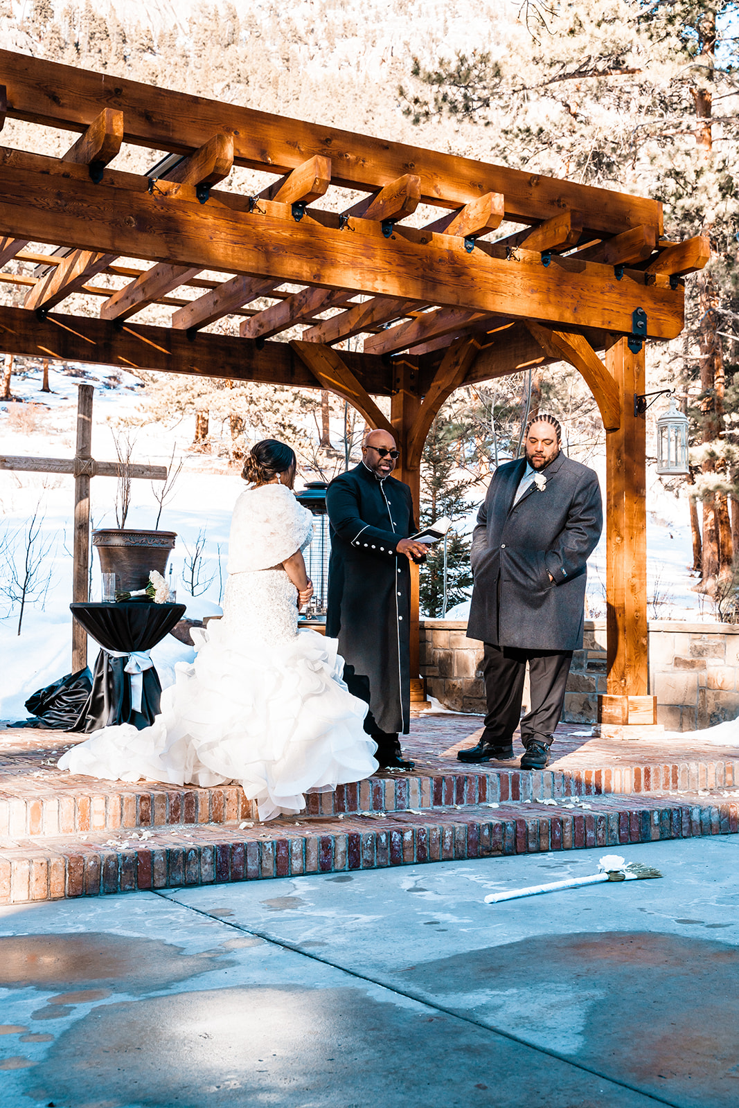 Bride and groom doing Jumping over the broom ceremony