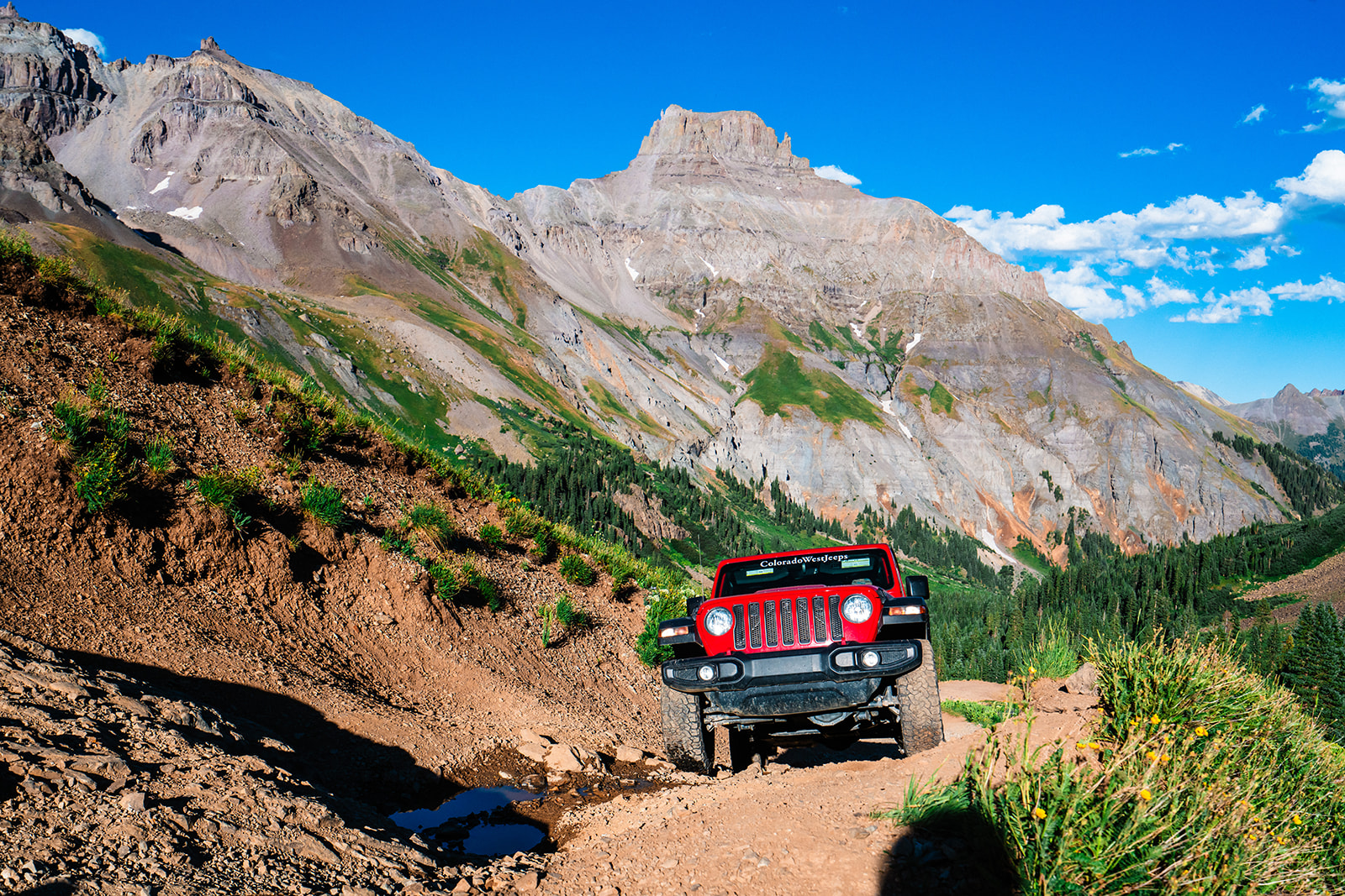Red Jeep off-roading in Ouray Colorado