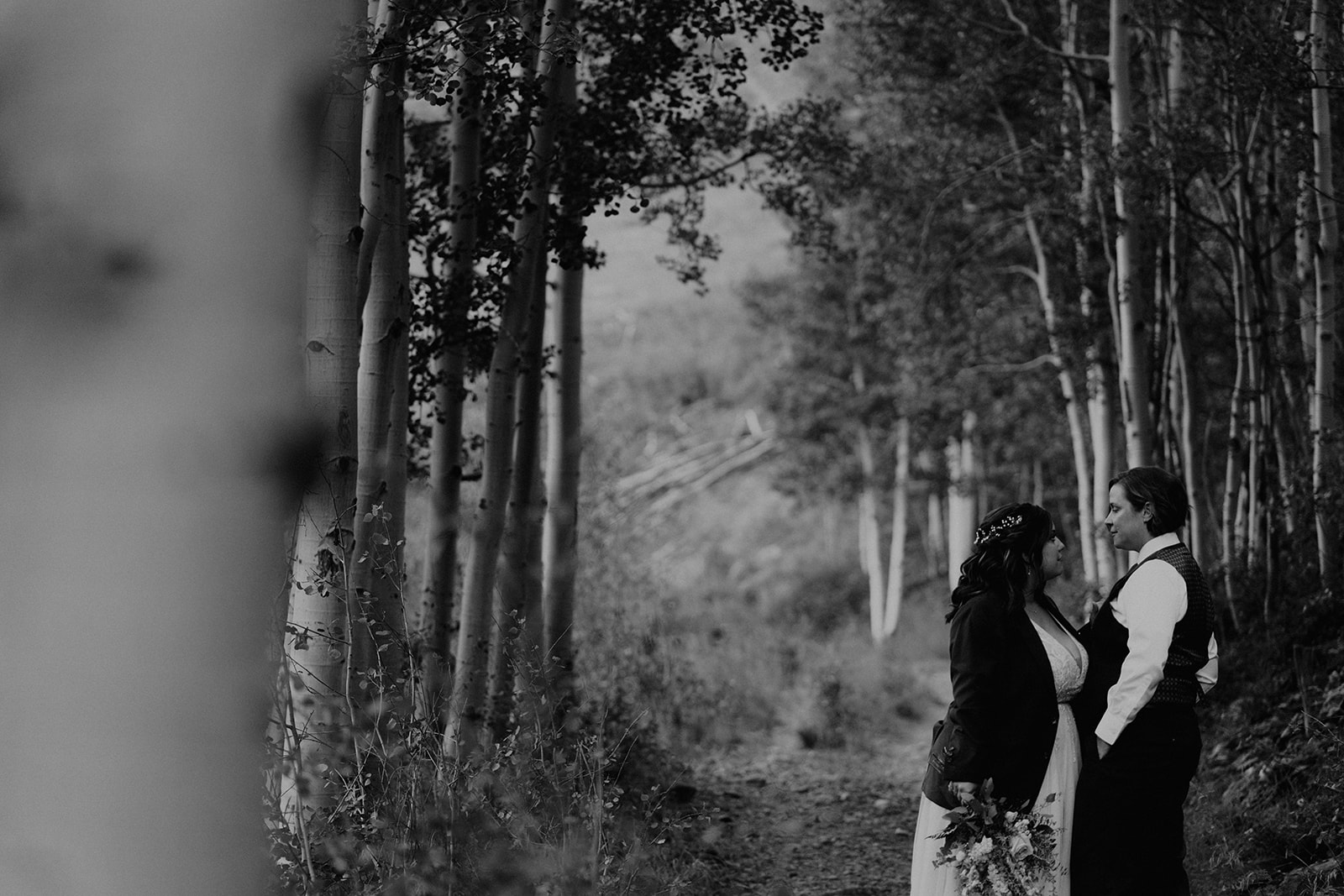 Black and white photo of lesbian couple in the forests