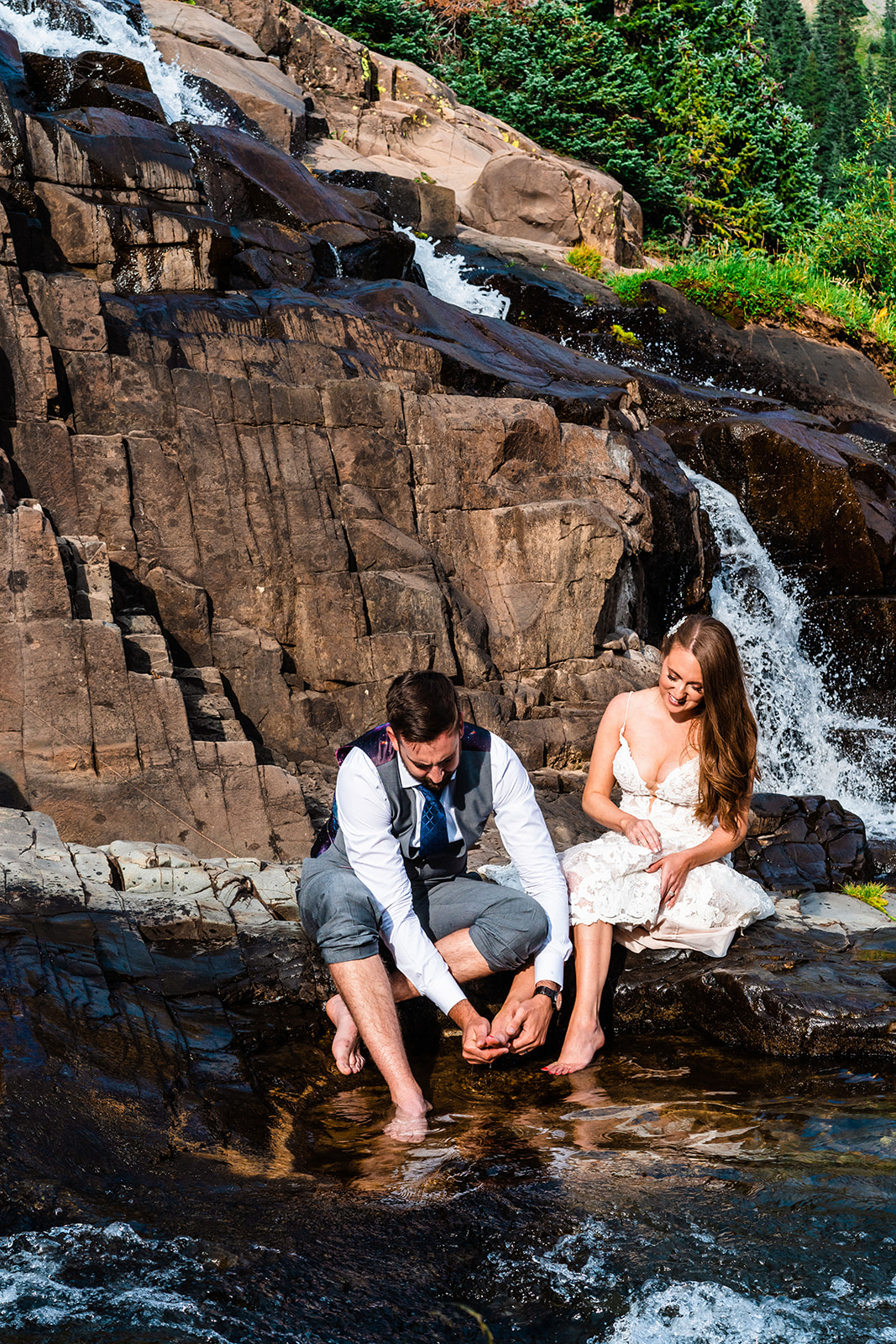 Bride and groom washing their feet for the foot washing ceremony