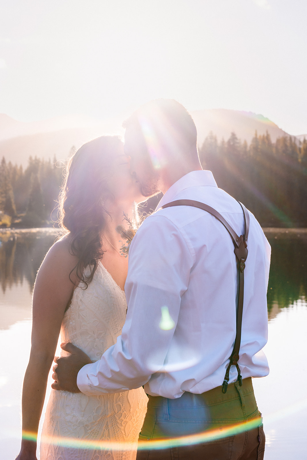 Bride and groom kissing one another at the San Juan Mountains