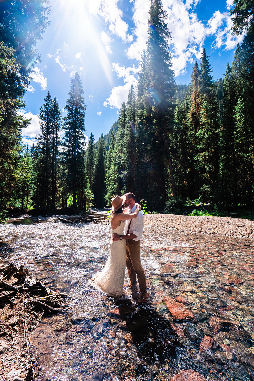 Bride and groom dancing in the forests of the San Juan mountains