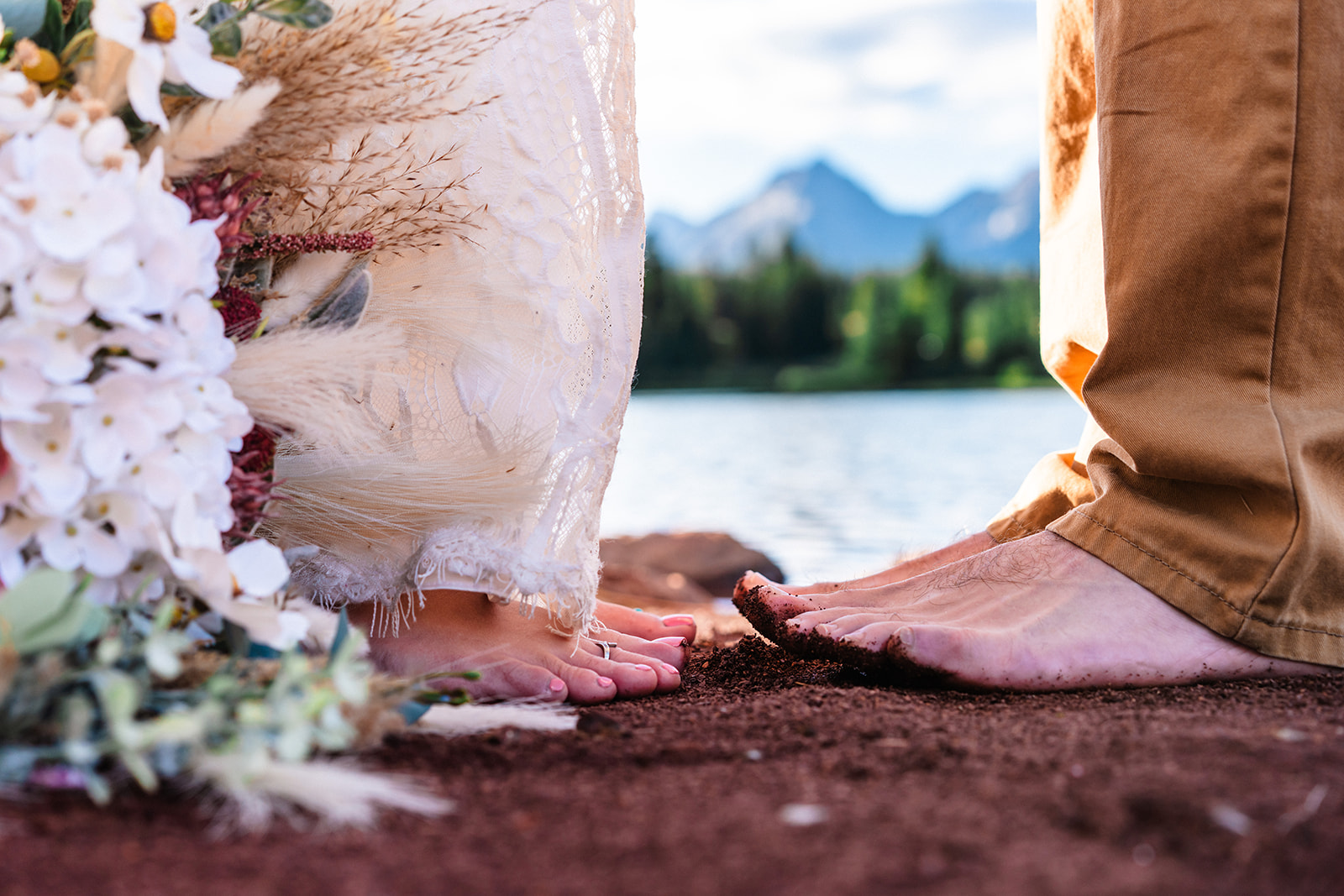Bride and groom grounding their bare feet into the ground in the San Juan Mountains