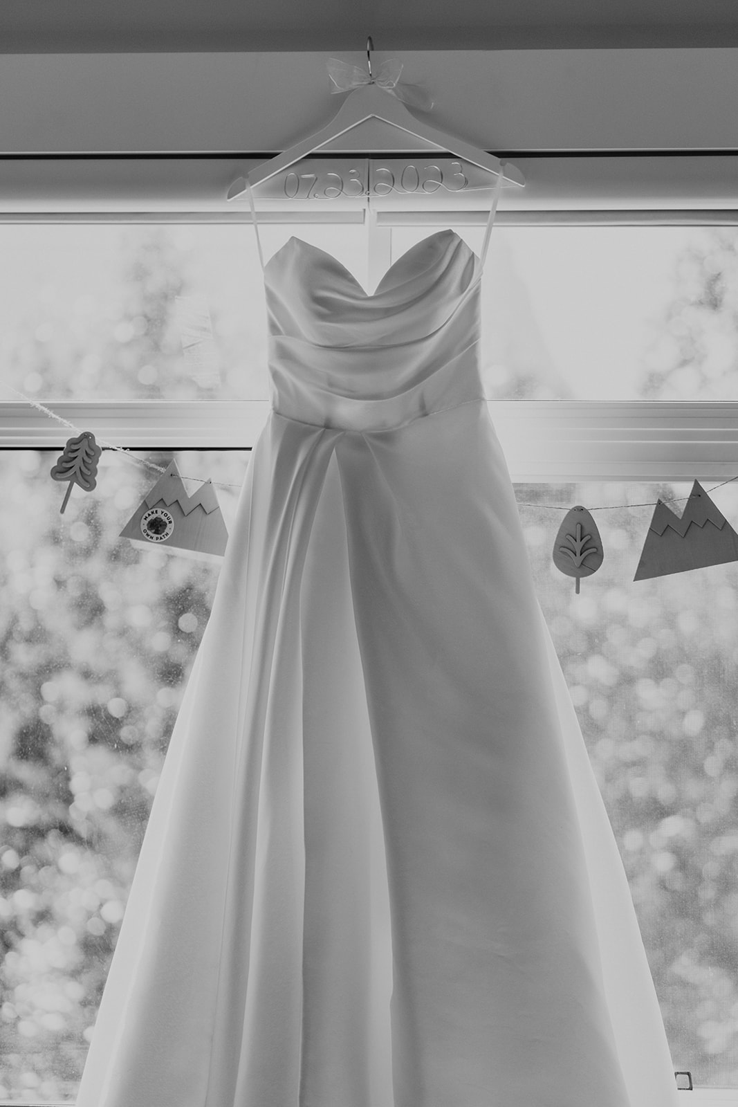 Black and white photo of strapless wedding dress