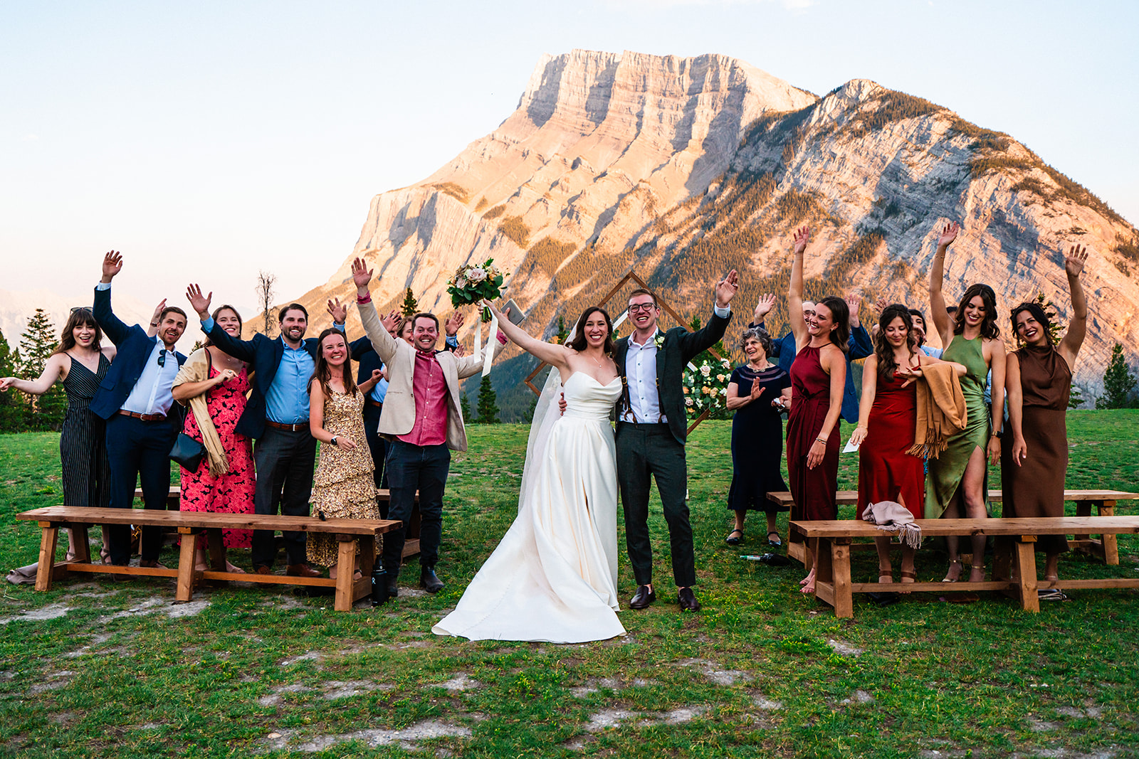 Bride and groom cheering after their Banff wedding ceremony