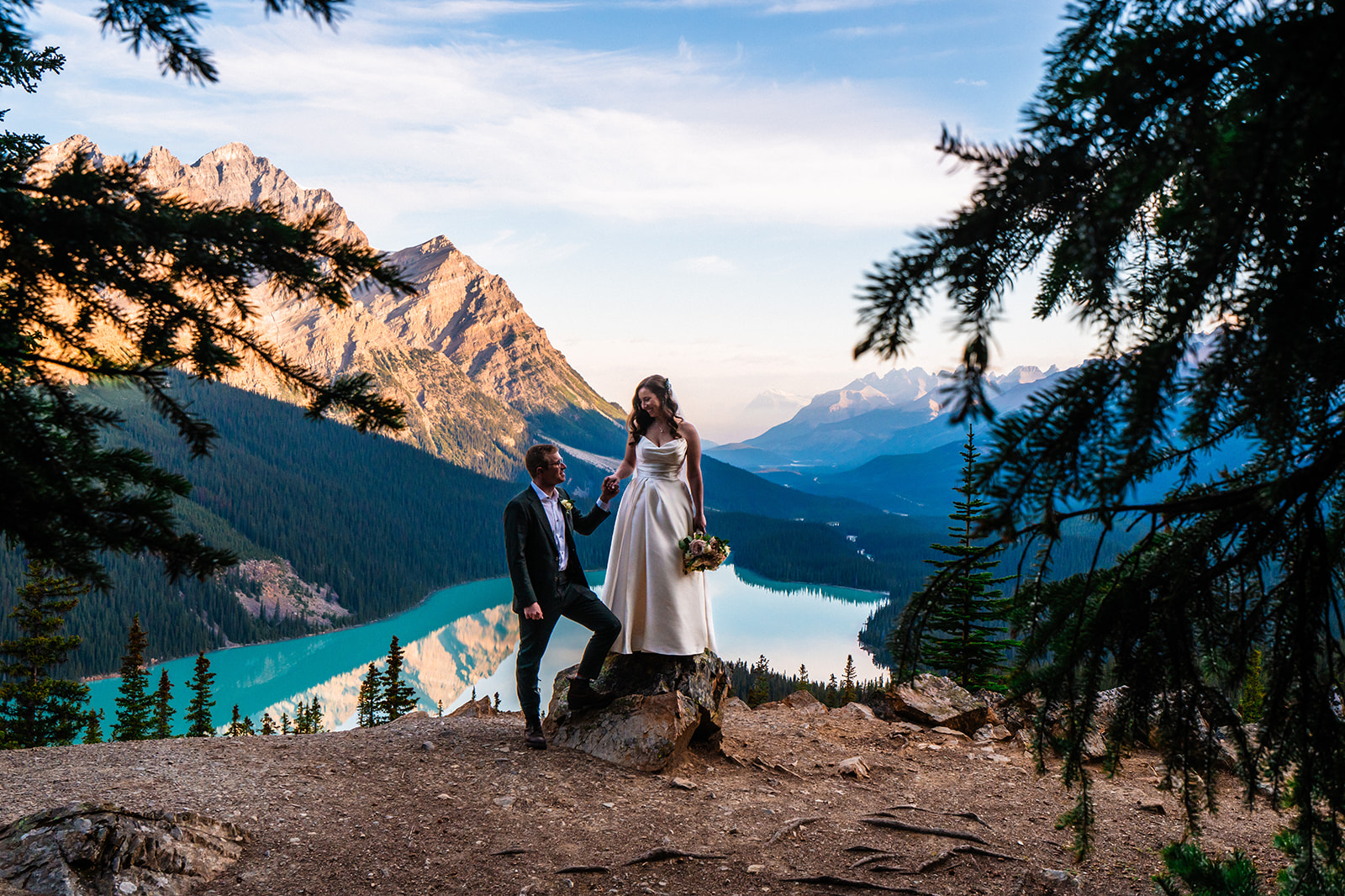 Bride and groom posing in the mountains of Banff, Canada