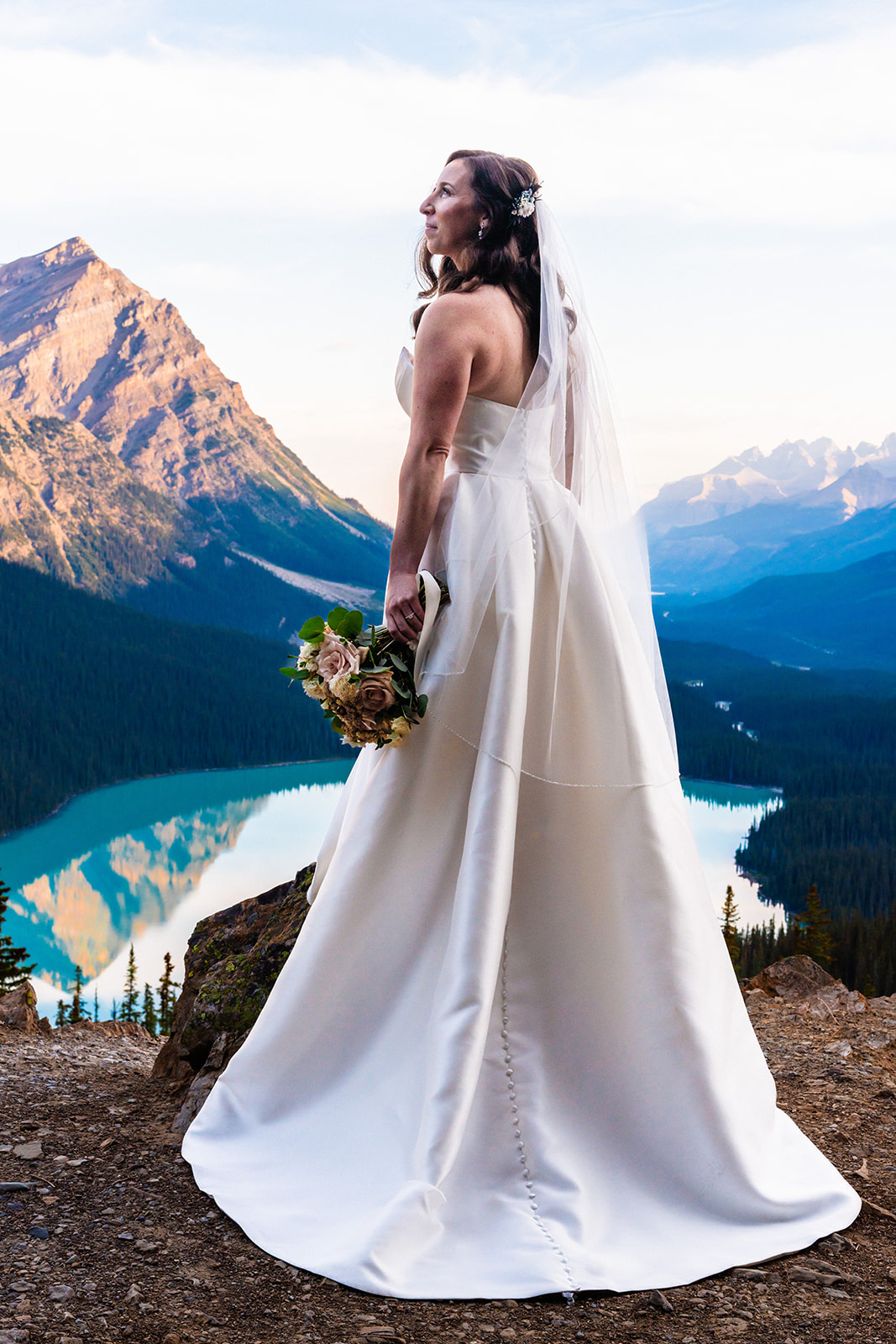 Stunning bride in a strapless wedding dress in Banff, Canada