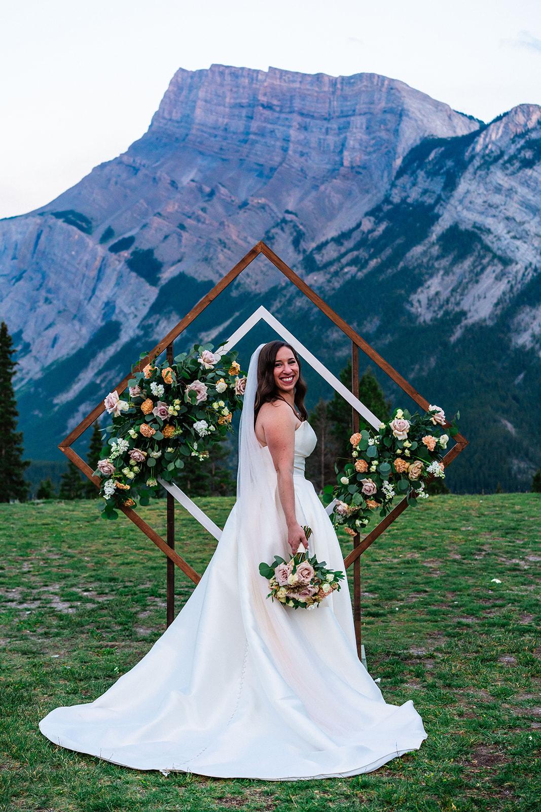 Stunning bride in a strapless wedding dress in Banff, Canada