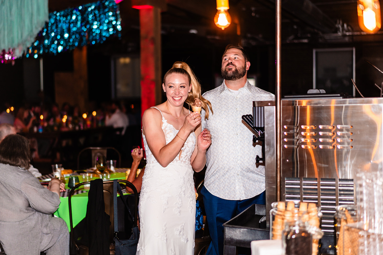 Bride and groom feeding each other ice cream during their elopement and wedding reception