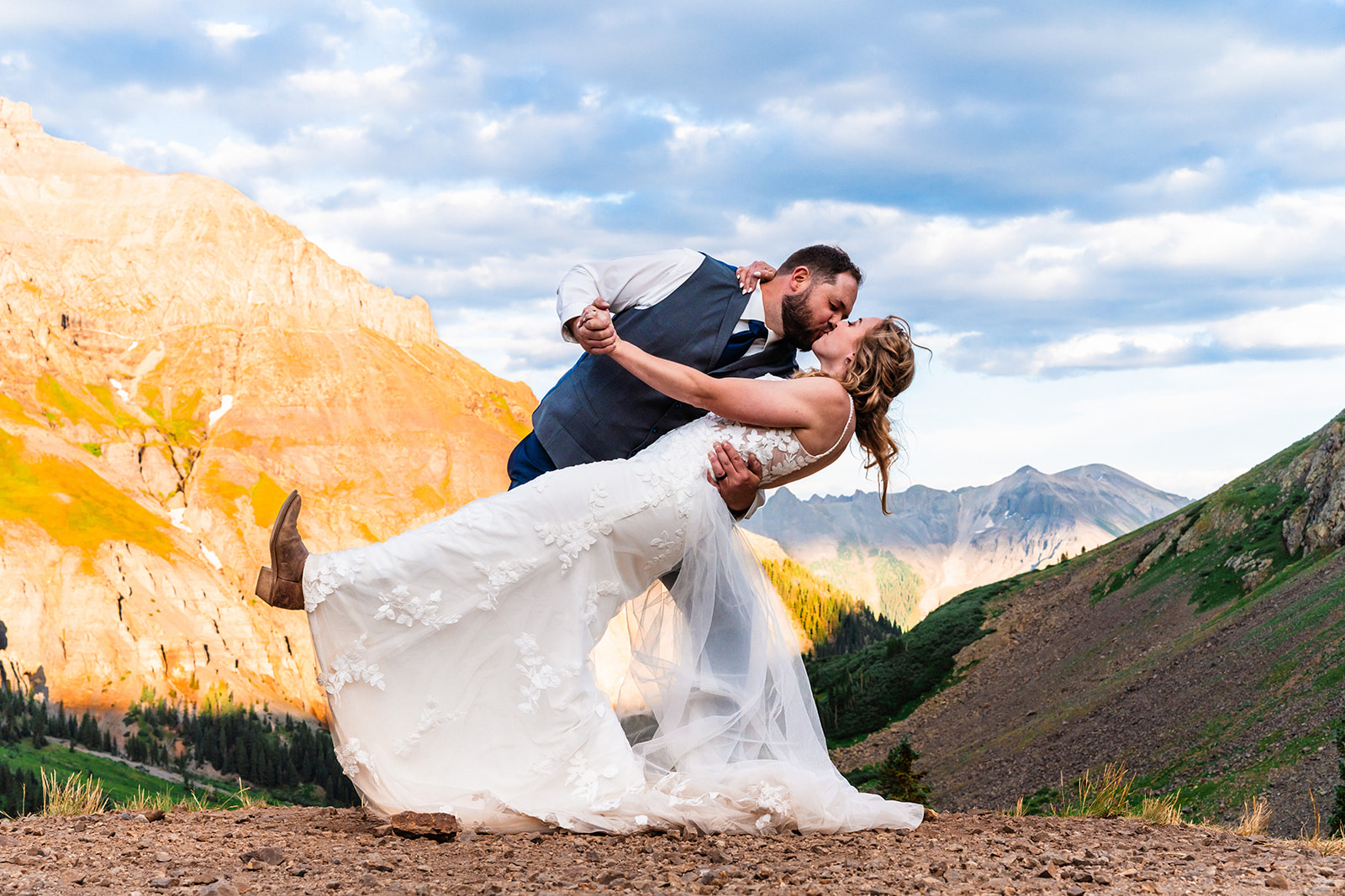 Groom dipping bride at Yankee Boy Basin for during elopement and wedding