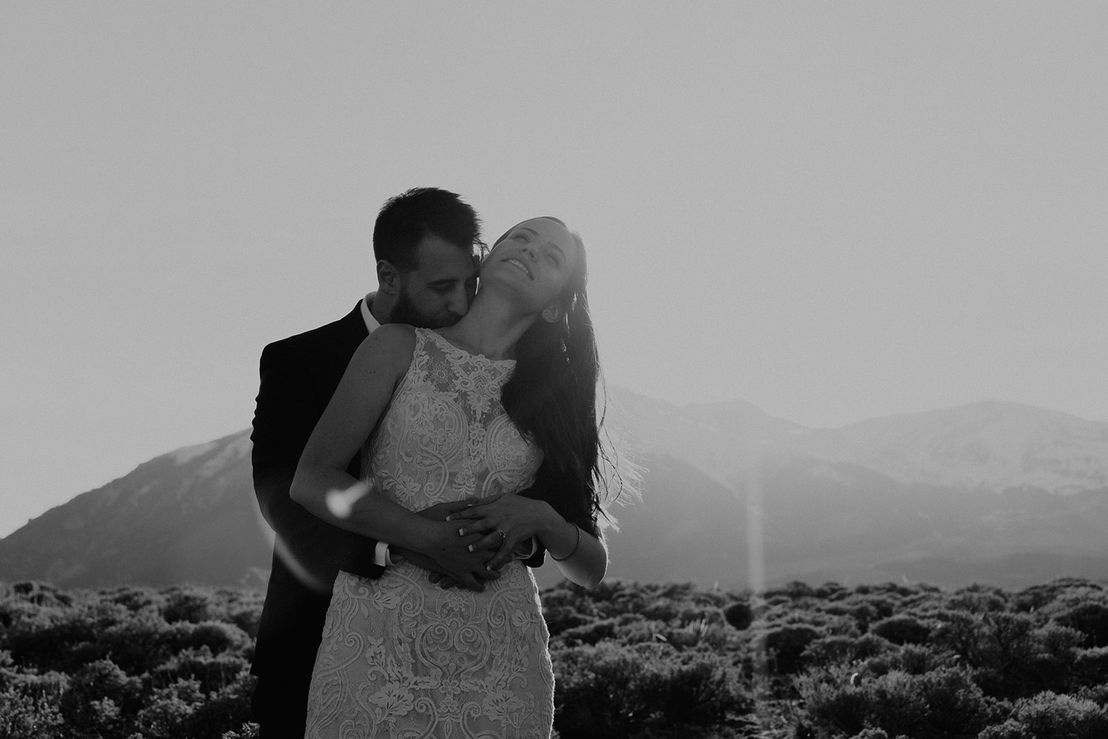 Black and white photo of bride and groom in the Colorado mountains for their Twin Lake elopement