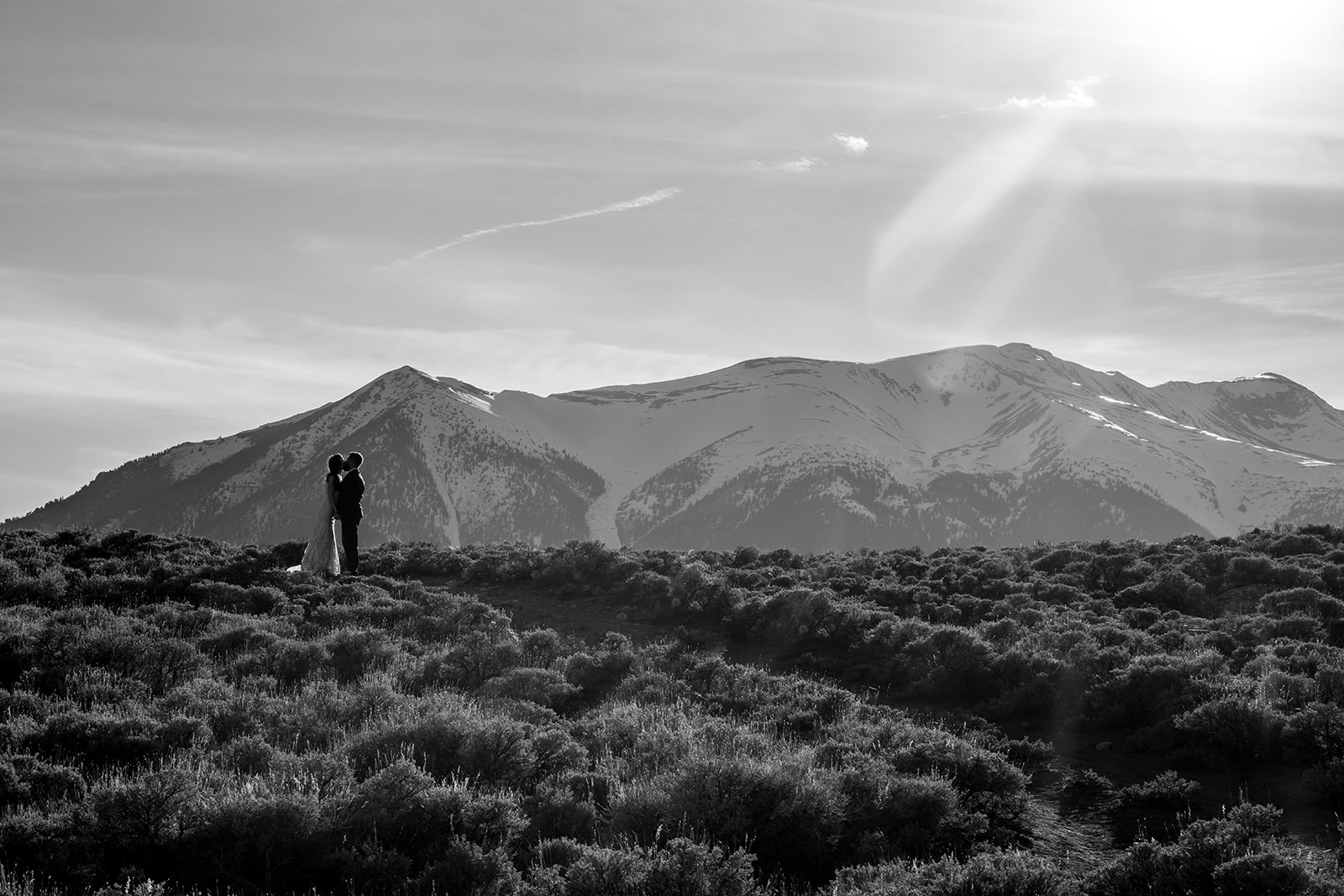 Black and white photo of bride and groom in the Colorado mountains for their Twin Lake elopement