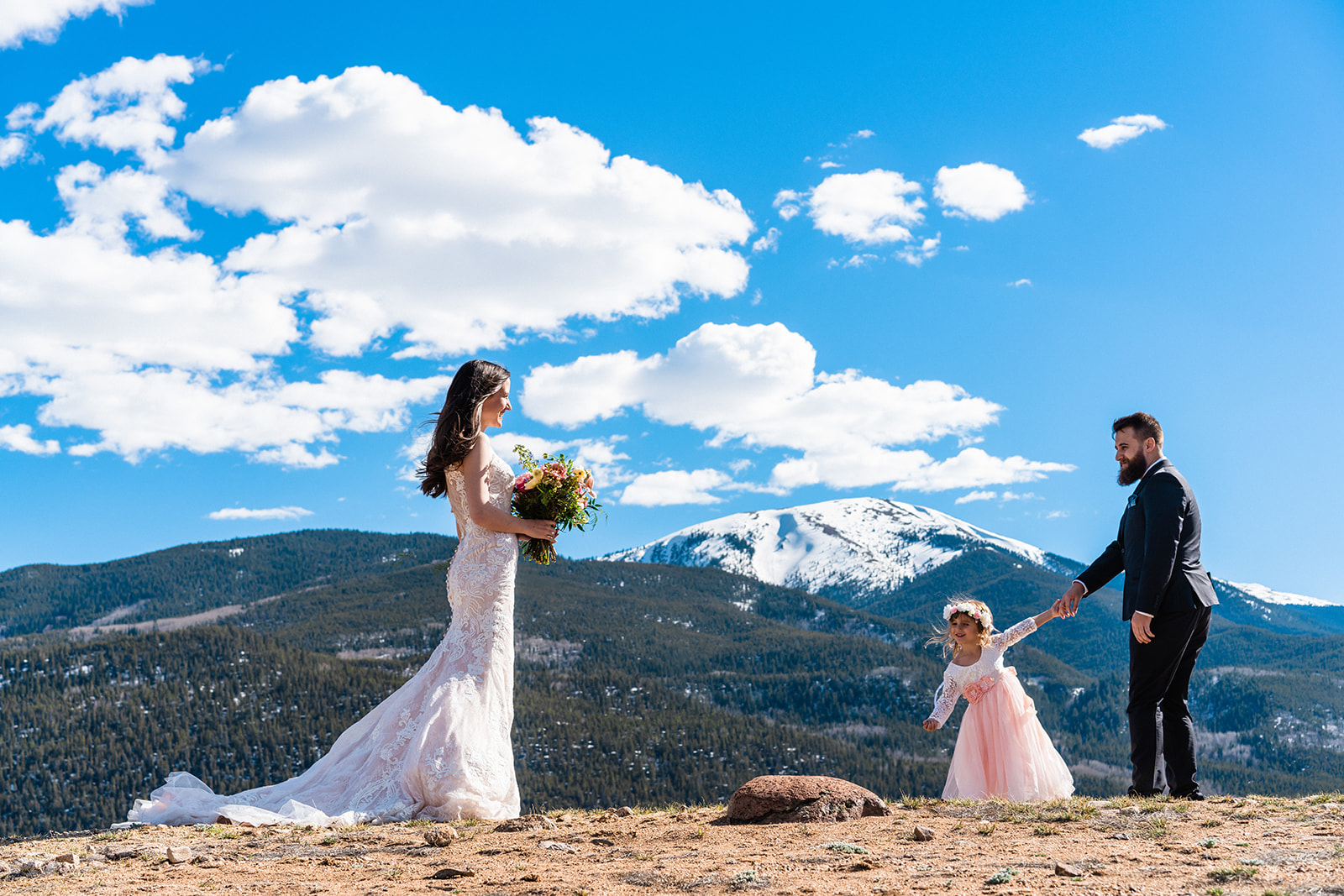 Bride and grooms first look with daughter in the Colorado mountains