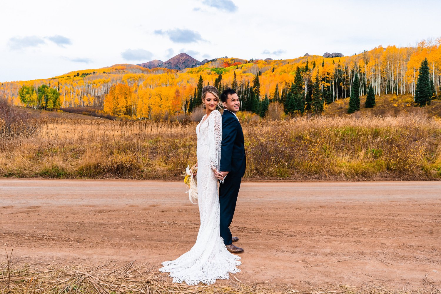 A stunning elopement photo capturing a bride and groom amidst the breathtaking aspen trees in Colorado.